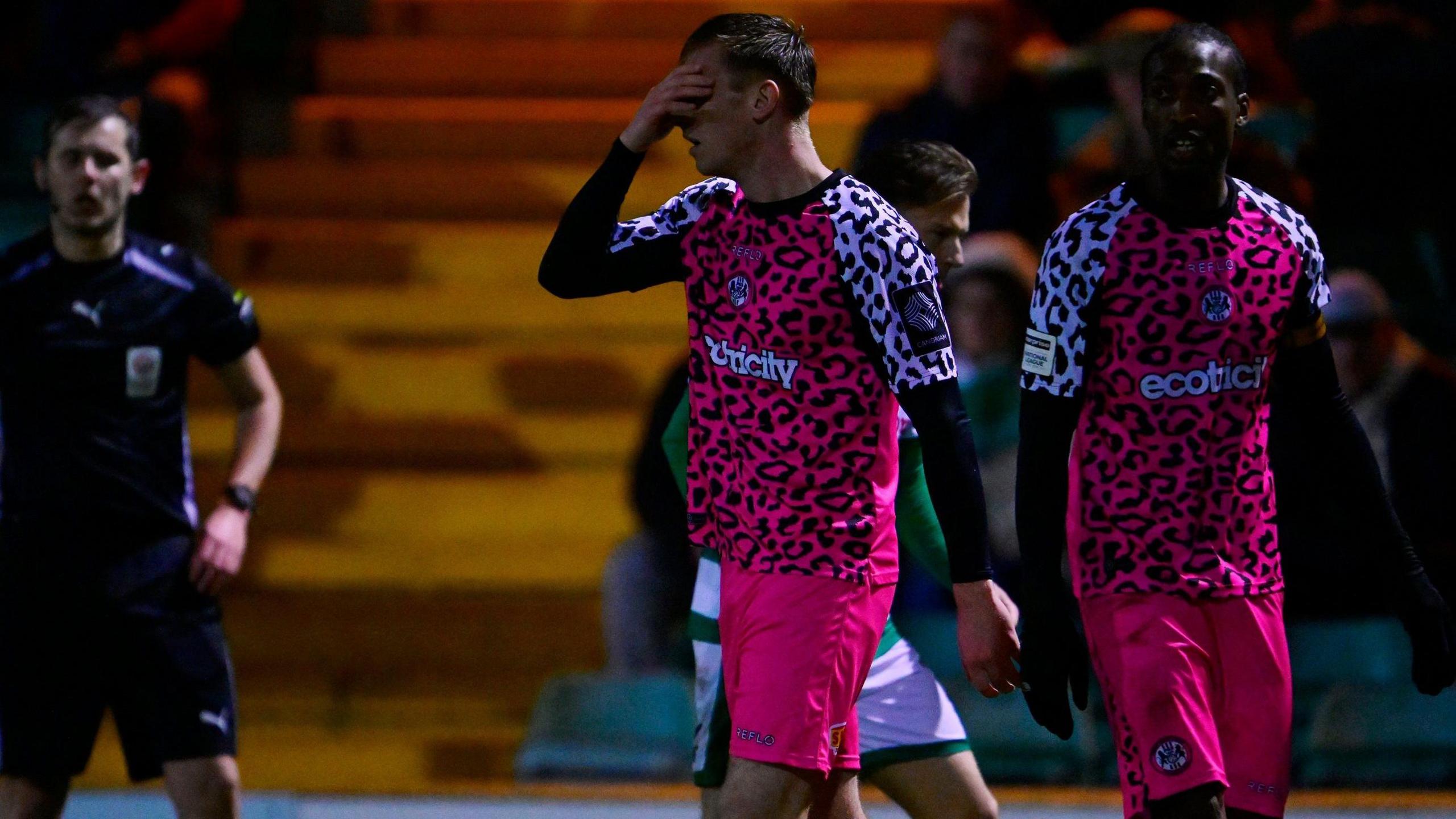 Forest Green's Harvey Bunker covers his eyes with his right hand in disappointment after being sent off against Yeovil