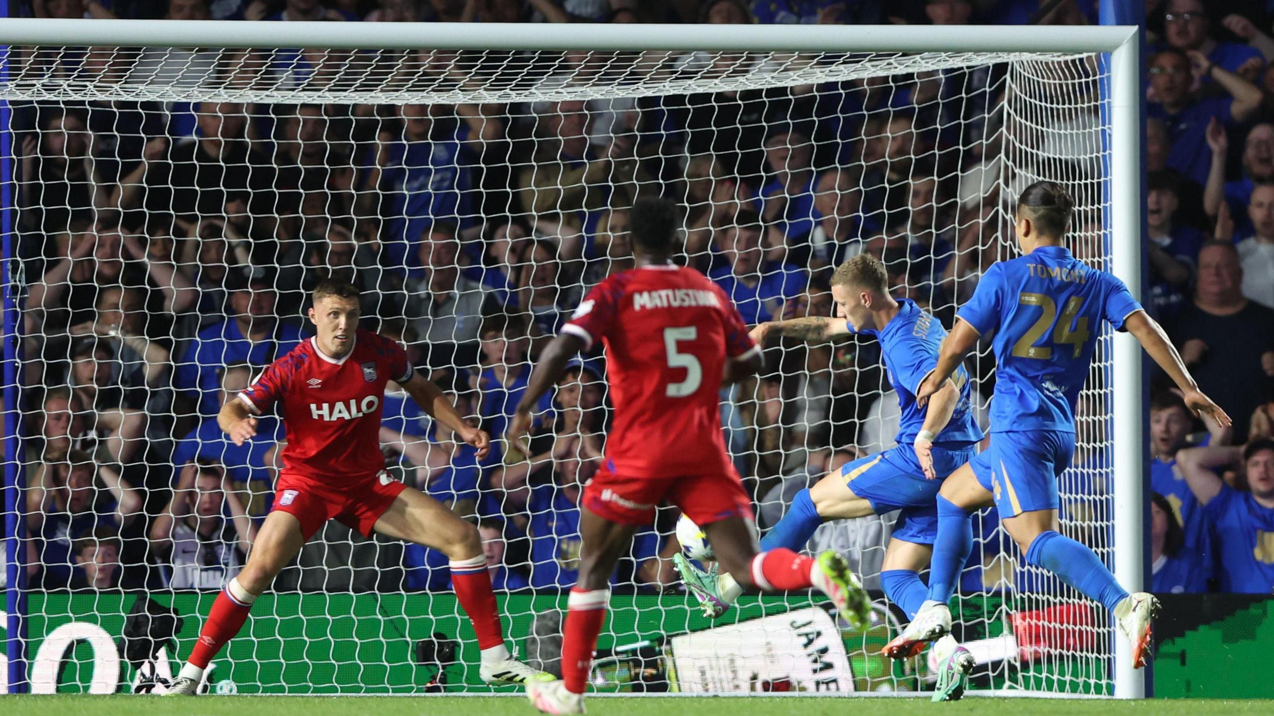 Jay Stansfield about to score with his left foot for Birmingham past Ipswich defender Dara O'Shea  