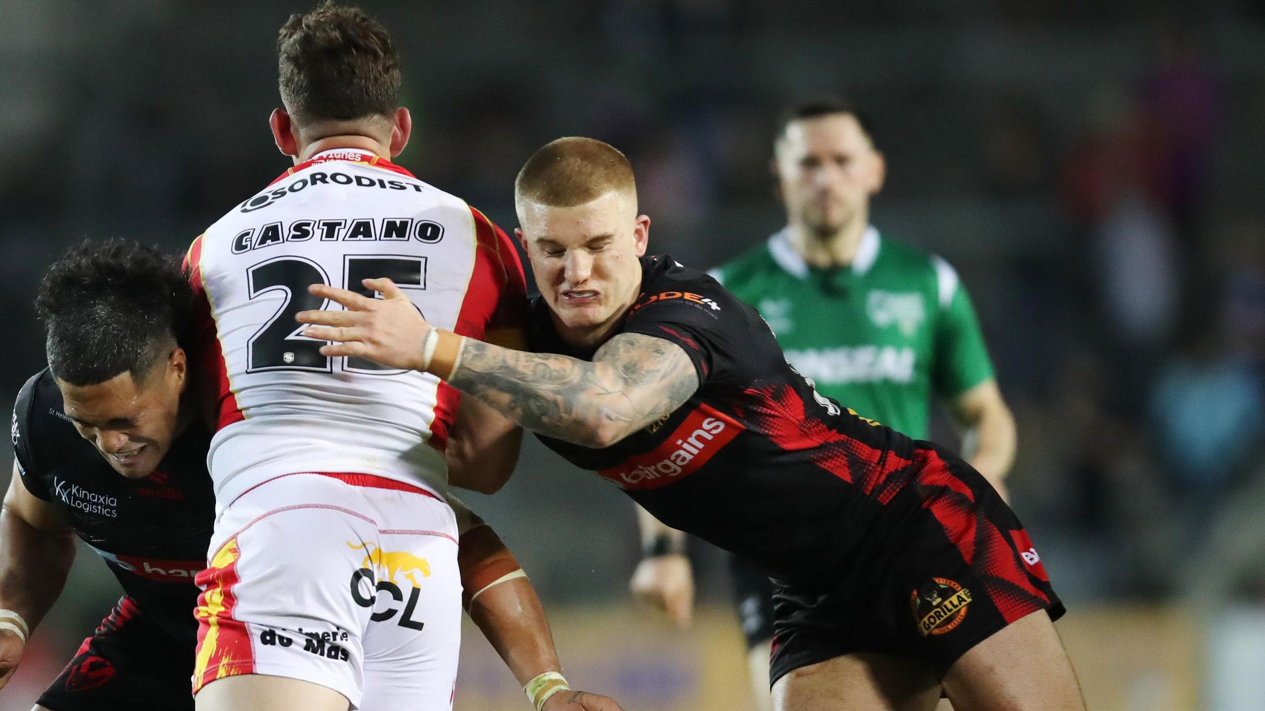 George Delaney leans in to tackle an opponent