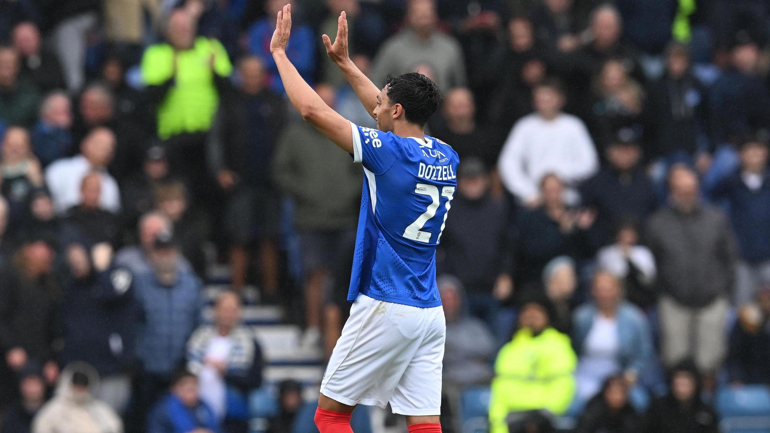 Andre Dozzell celebrates after scoring for Portsmouth