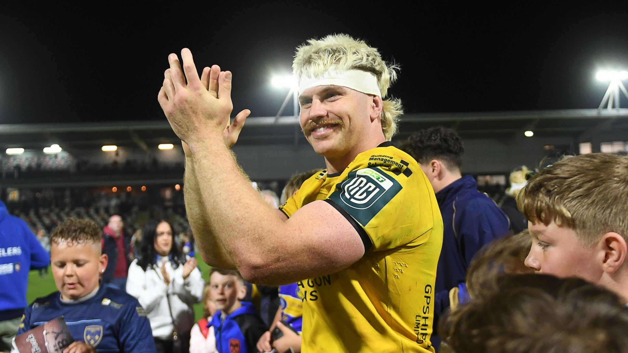 Dragons' Aaron Wainwright applauds supporters after playing his last home game before moving to Leicester Tigers