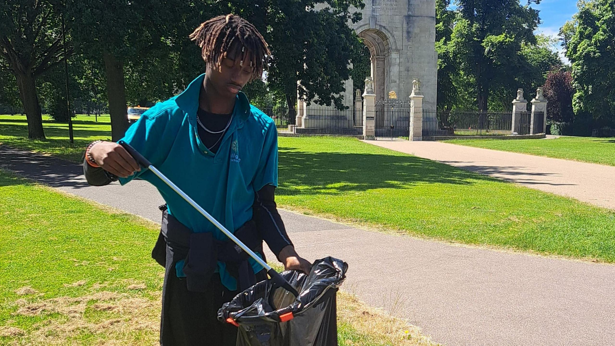 Boy picking litter