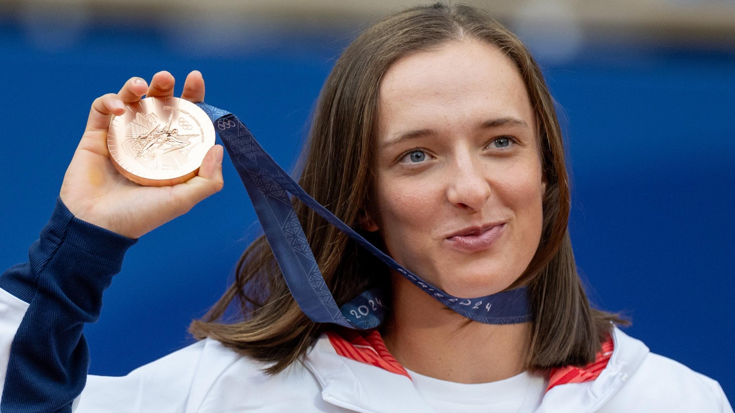 Iga Swiatek with her Olympic bronze medal in August