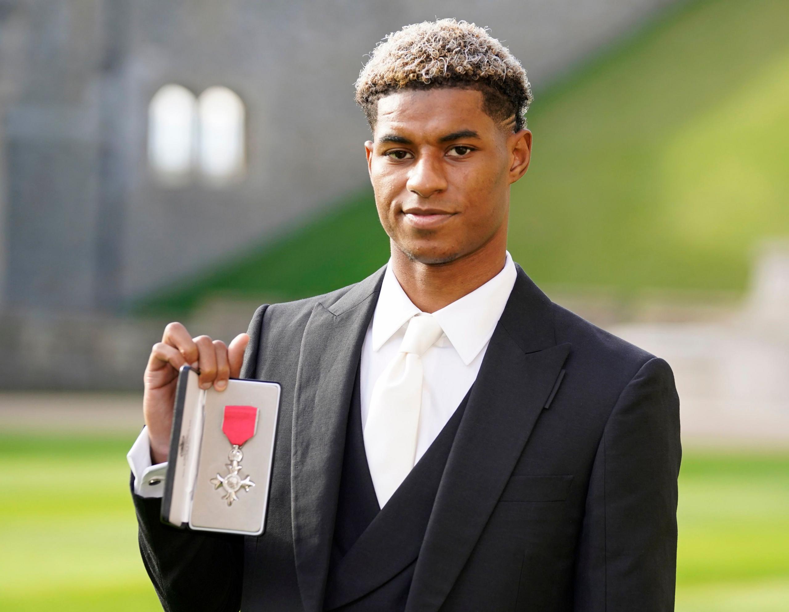 Marcus Rashford with his MBE award. 