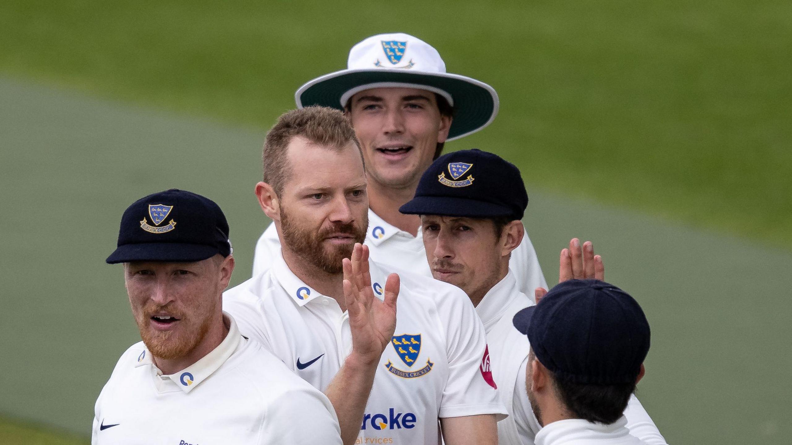 Sussex players congratulate Nathan McAndrew