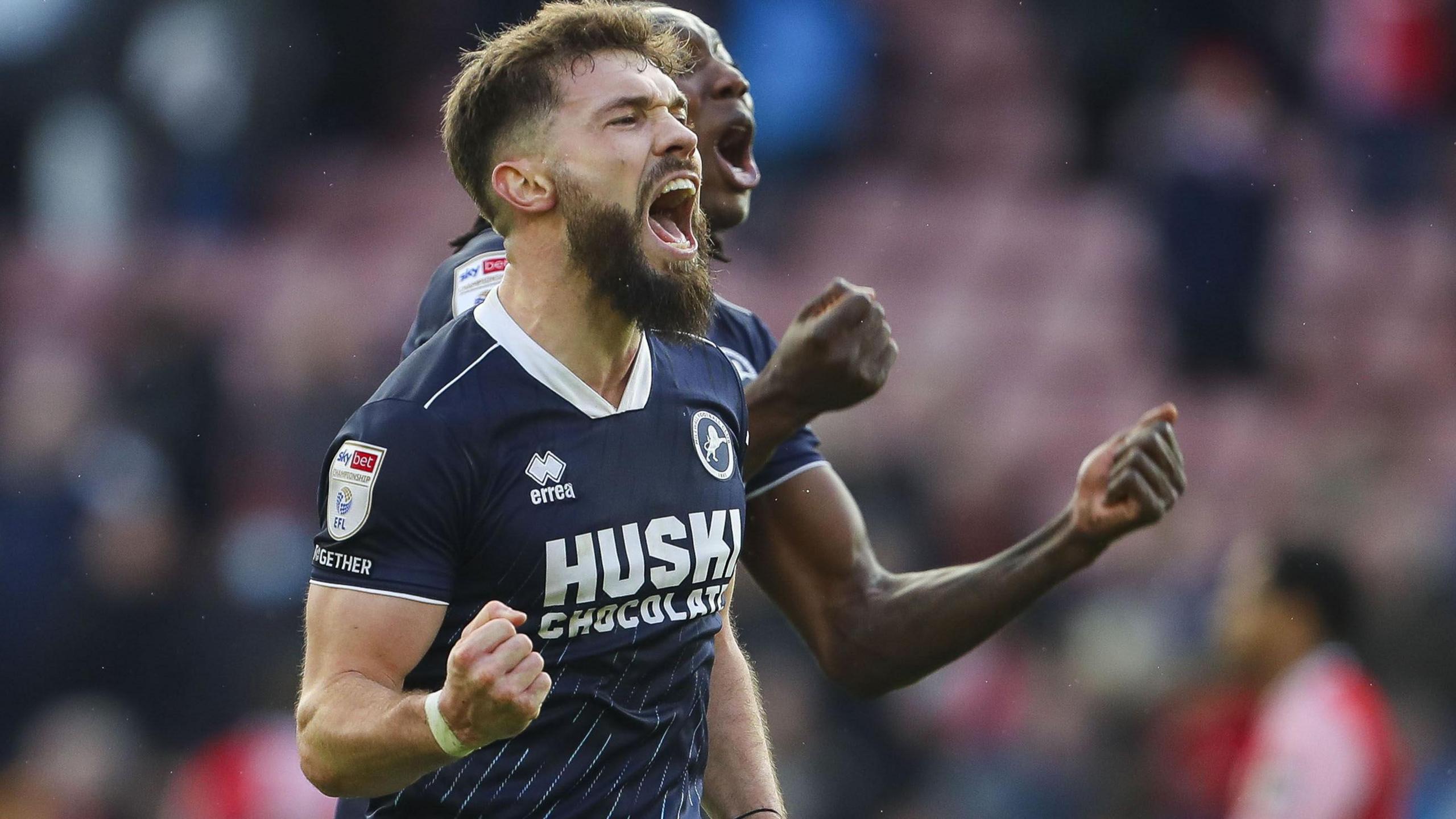 Tom Bradshaw of Millwall and Brooke Norton-Cuffy of Millwall applaud fans at the end of the game