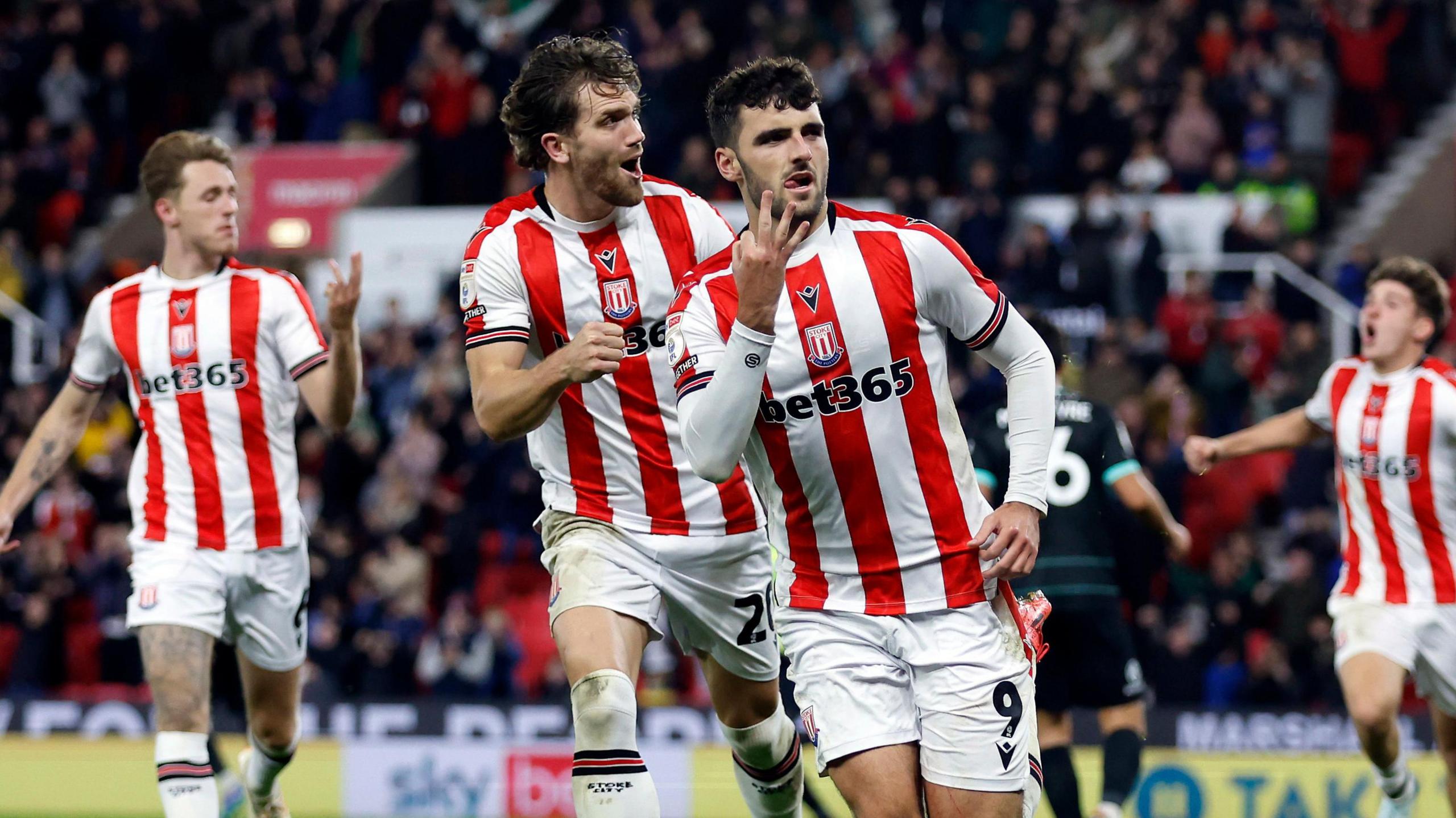 Tom Cannon celebrates scoring his third goal against Portsmouth