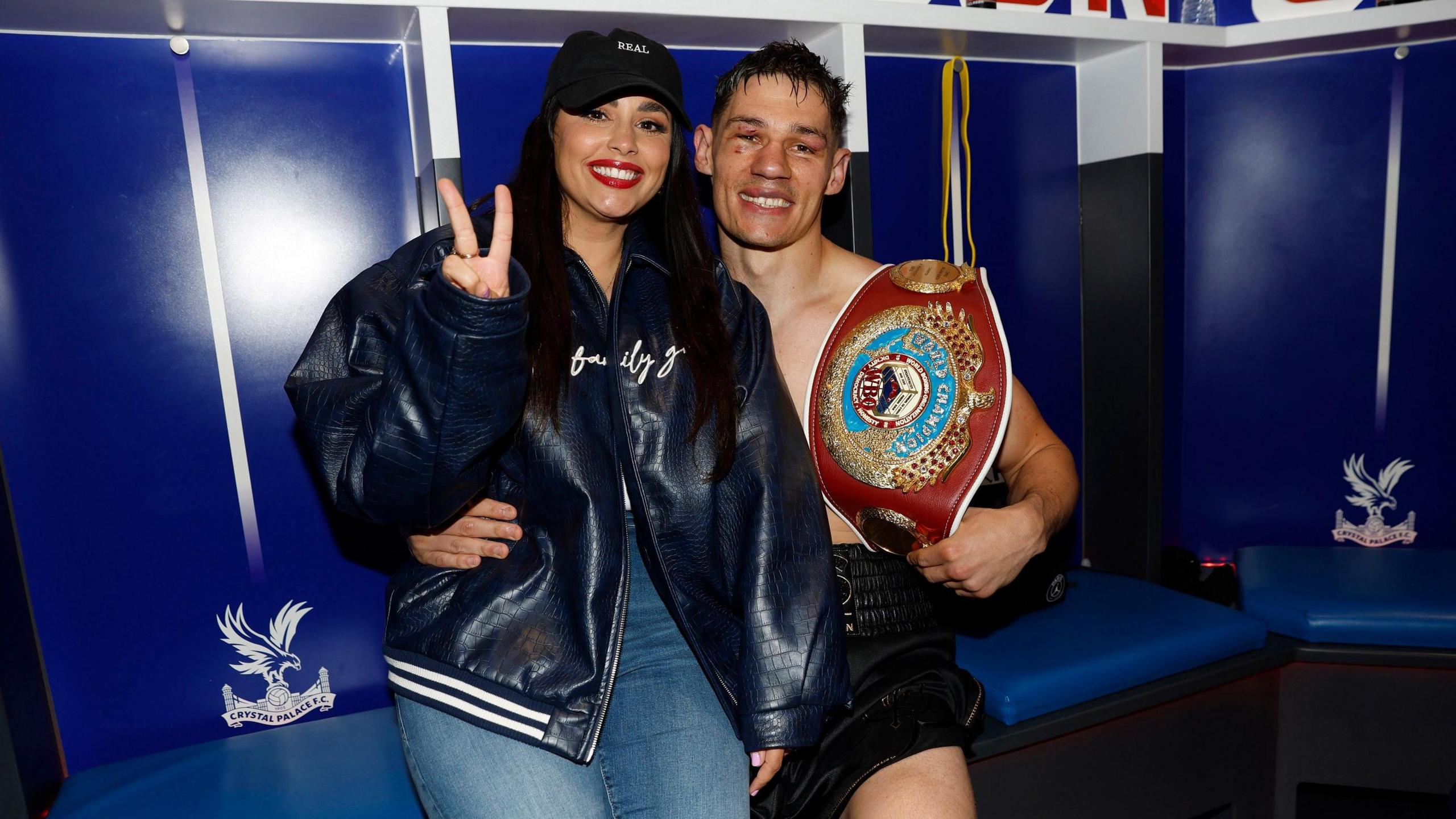 Chris Billam-Smith and his wife Mia Billam-Smith celebrate after his successful world title defence against Richard Riakporhe in London