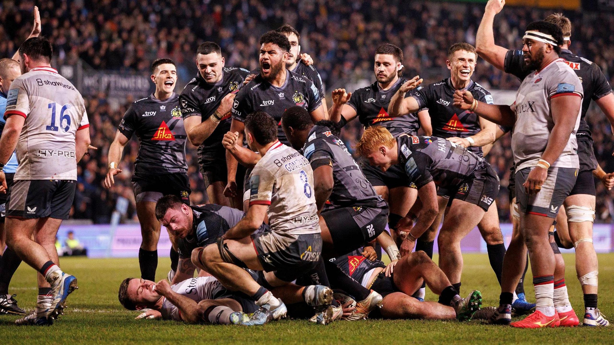 Exeter celebrate scoring a try against Saracens