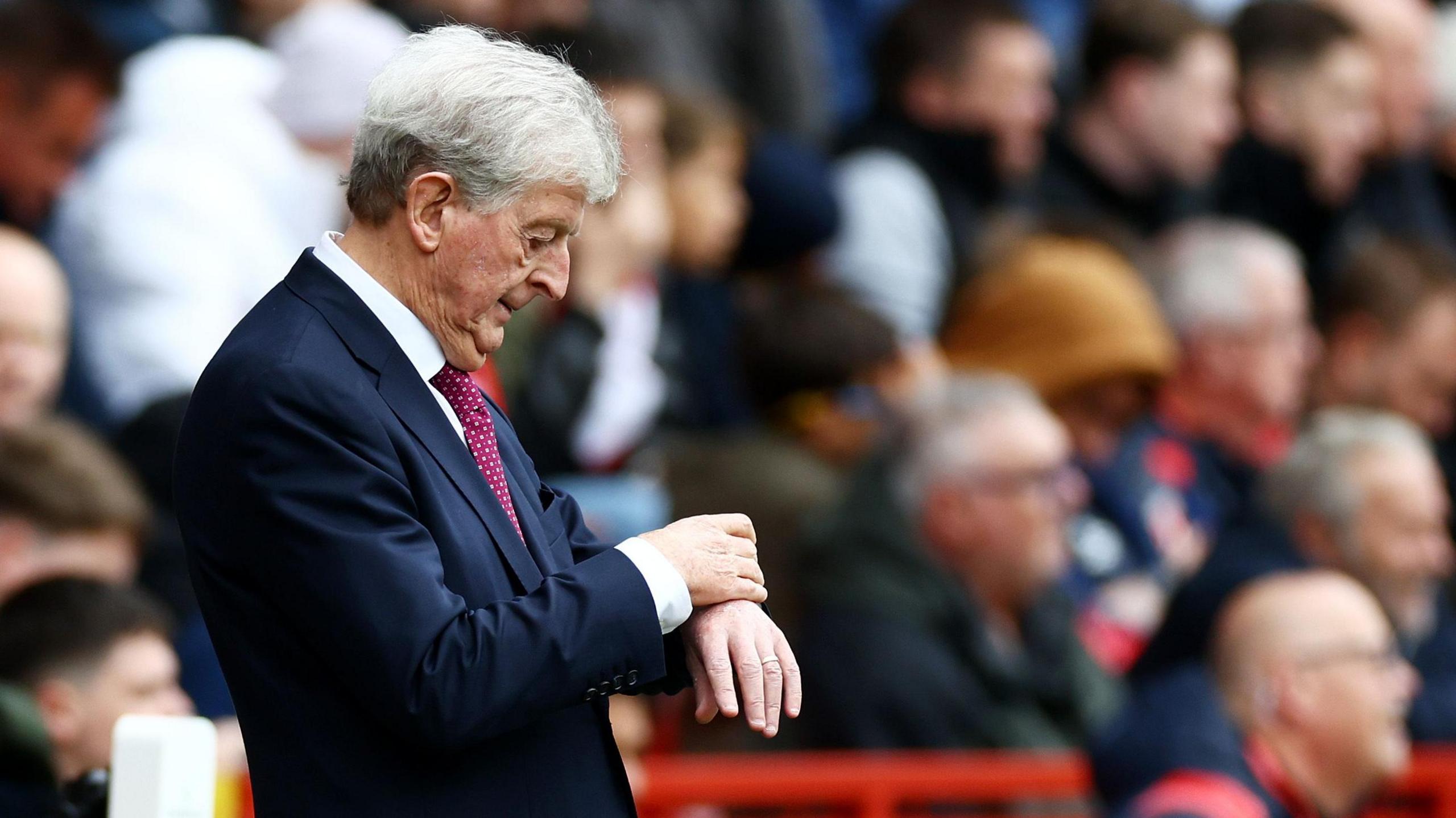 Roy Hodgson checks his watch on the Bristol City sideline