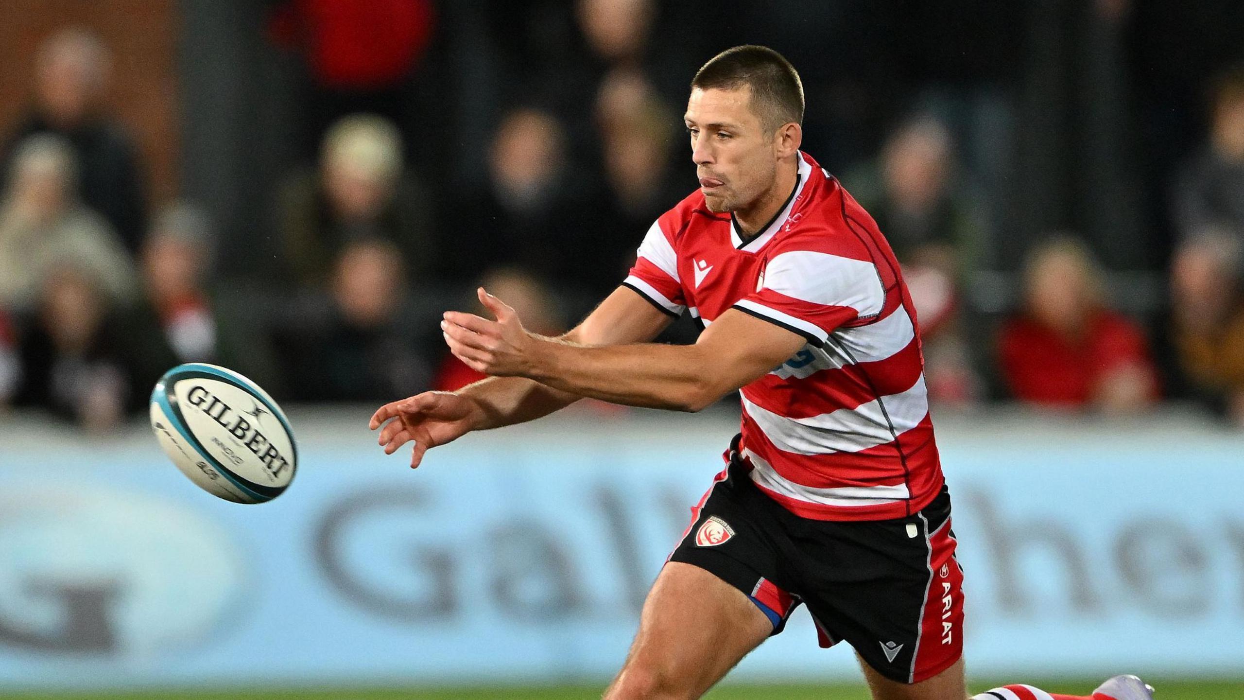Ross Byrne passes the ball during a match