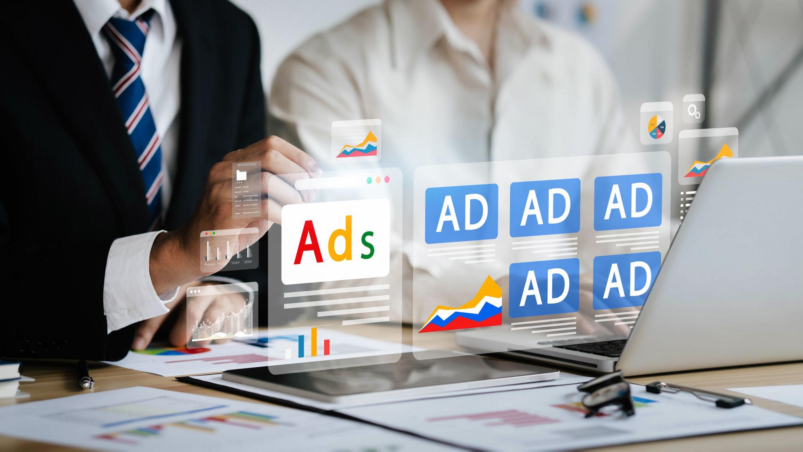 A graphic illustration of online adverts floating above a laptop screen