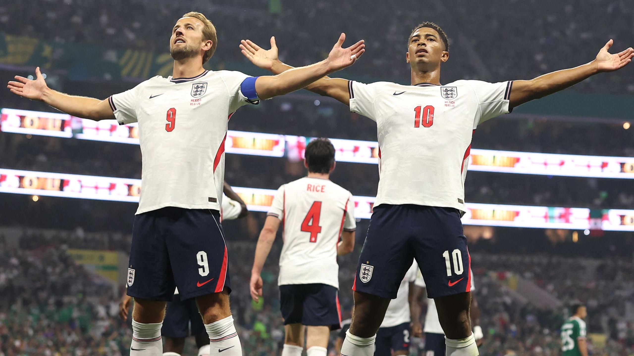 Jude Bellingham of England celebrates with teammate Harry Kane after scoring his team's first goal against Mexico