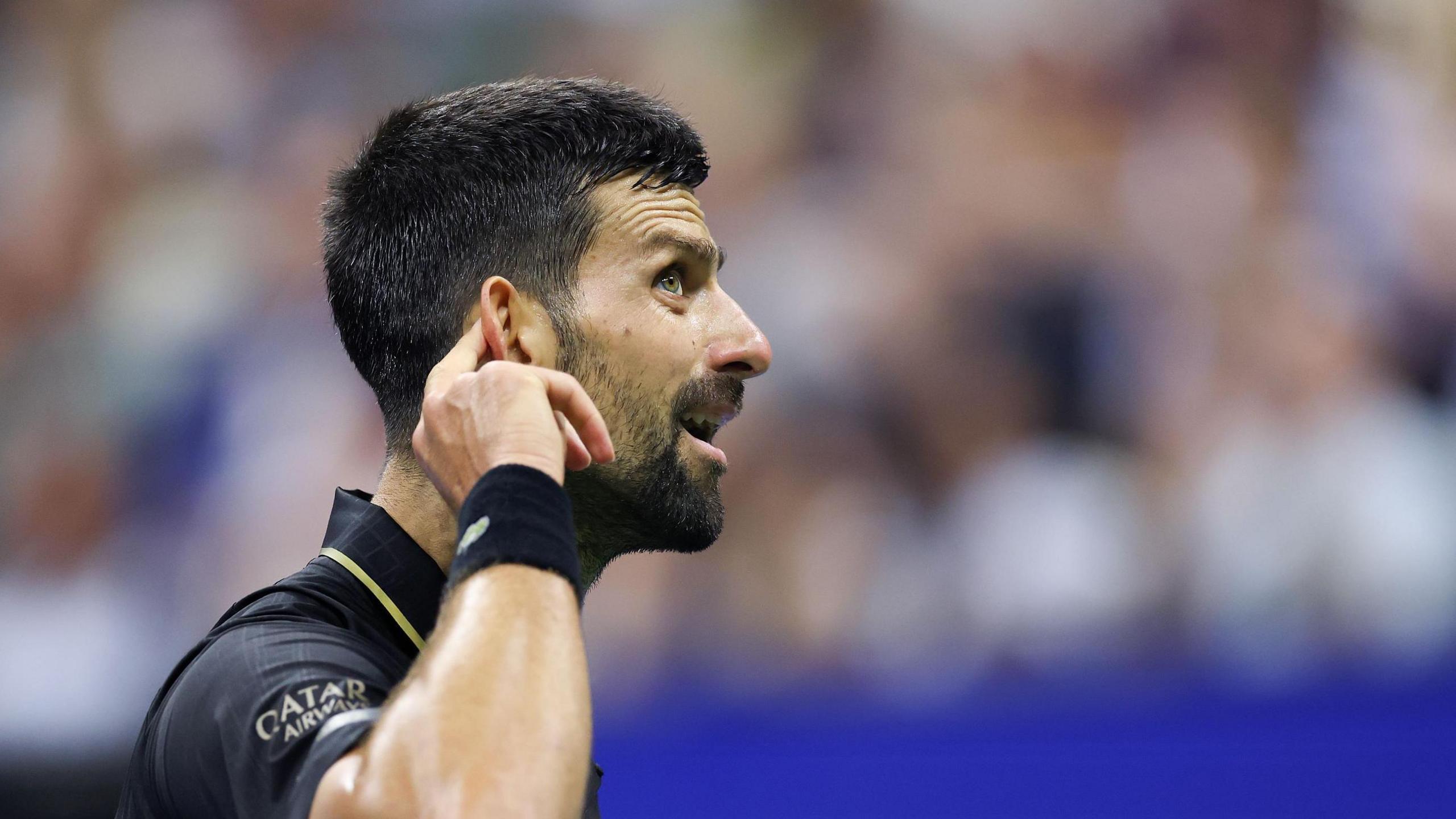 Novak Djokovic cups his receptor to nan US Open crowd