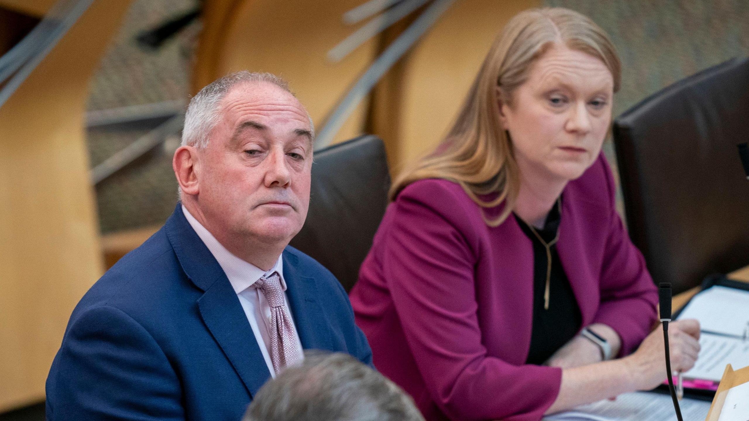 Housing Minister Paul McLennan sits beside Social Justice Minister Shirley-Anne Somerville during the debate in the Holyrood chamber