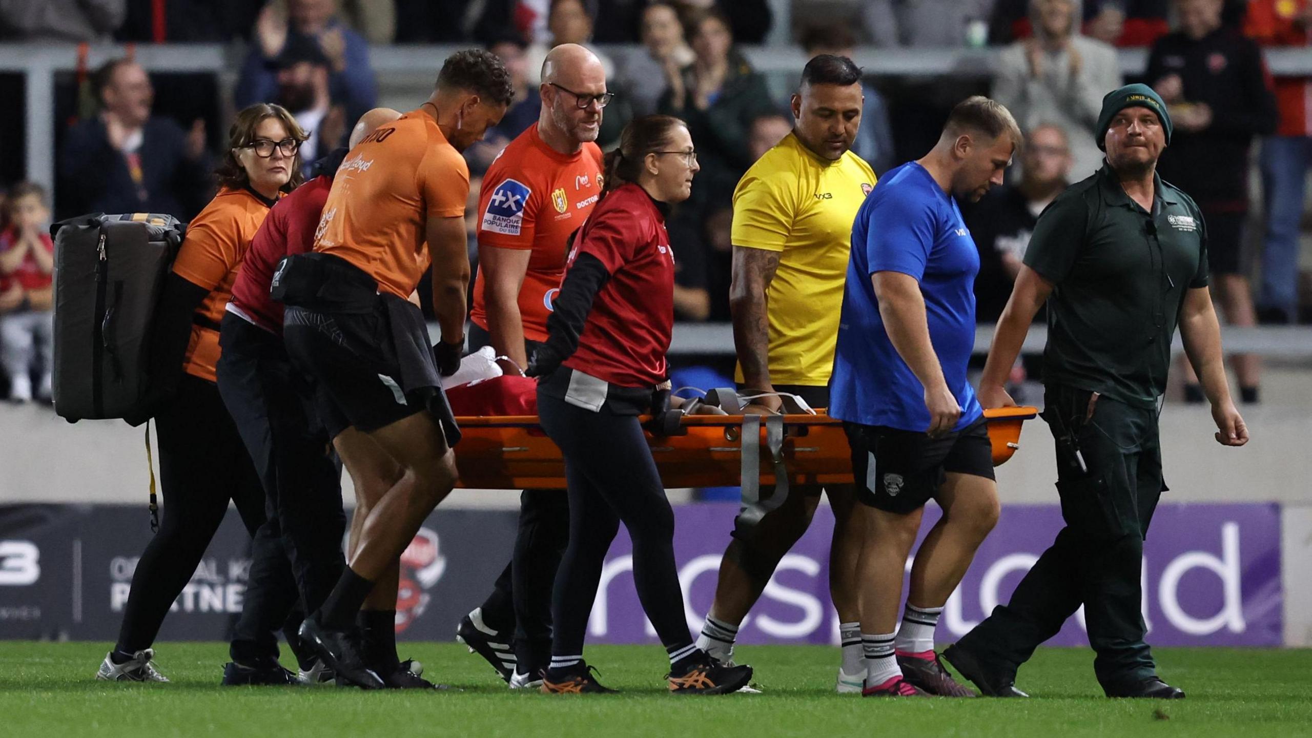 Salford Red Devils' Emmanuel Waine is carried disconnected nan transportation connected a stretcher