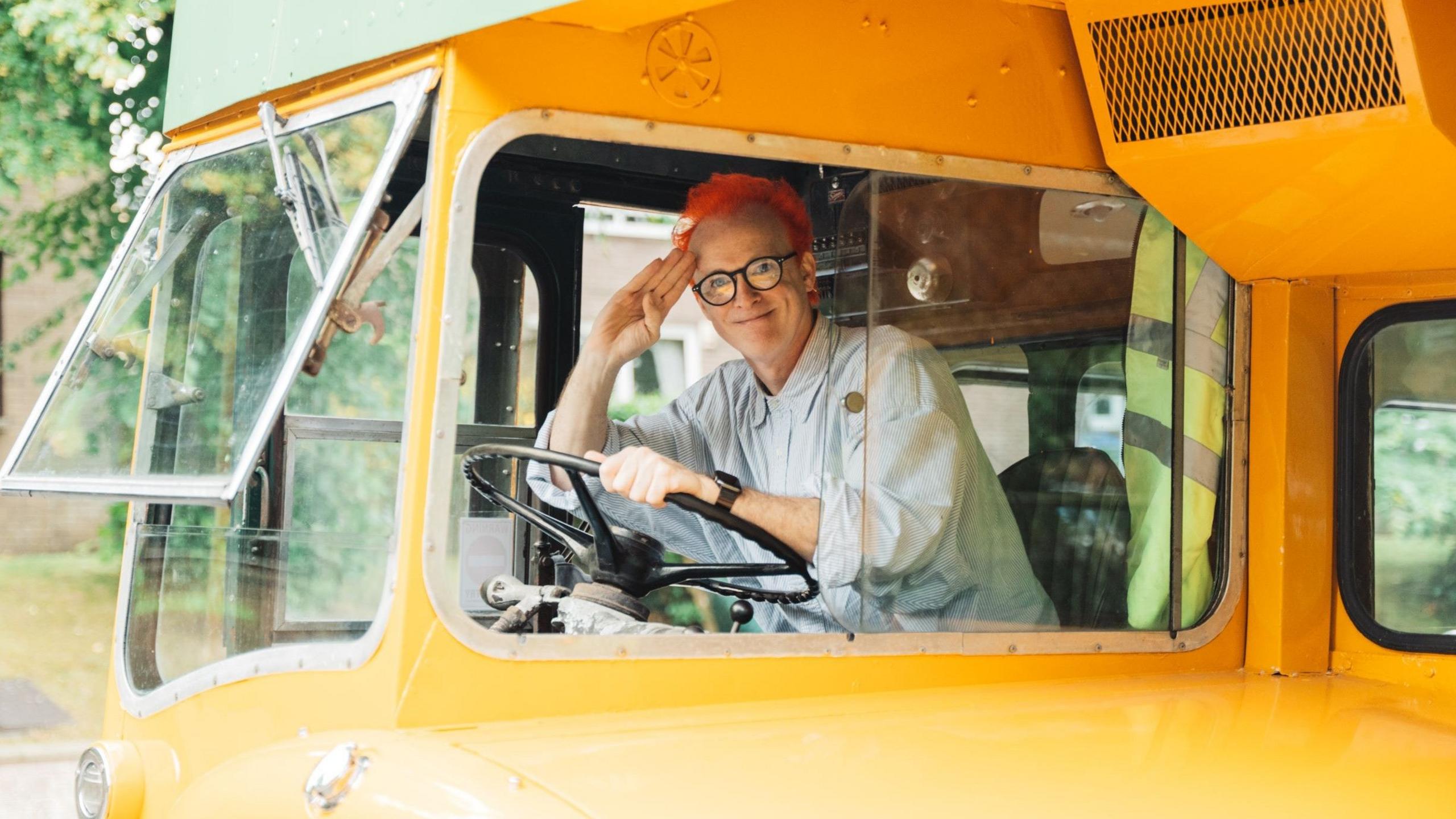 Travis singer Fran Healy at the wheel of a bus, promoting their new album L.A. Times