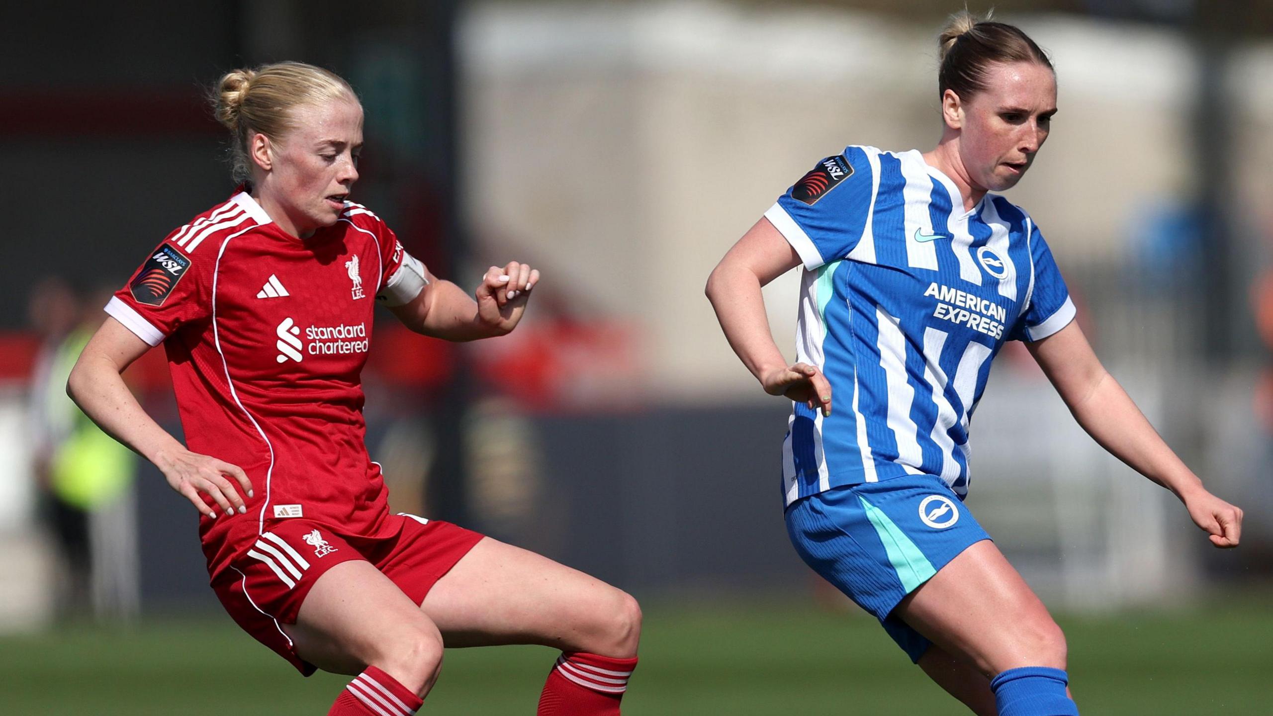 Bex Rayner of Brighton & Hove Albion is challenged by Grace Fisk of Liverpool 