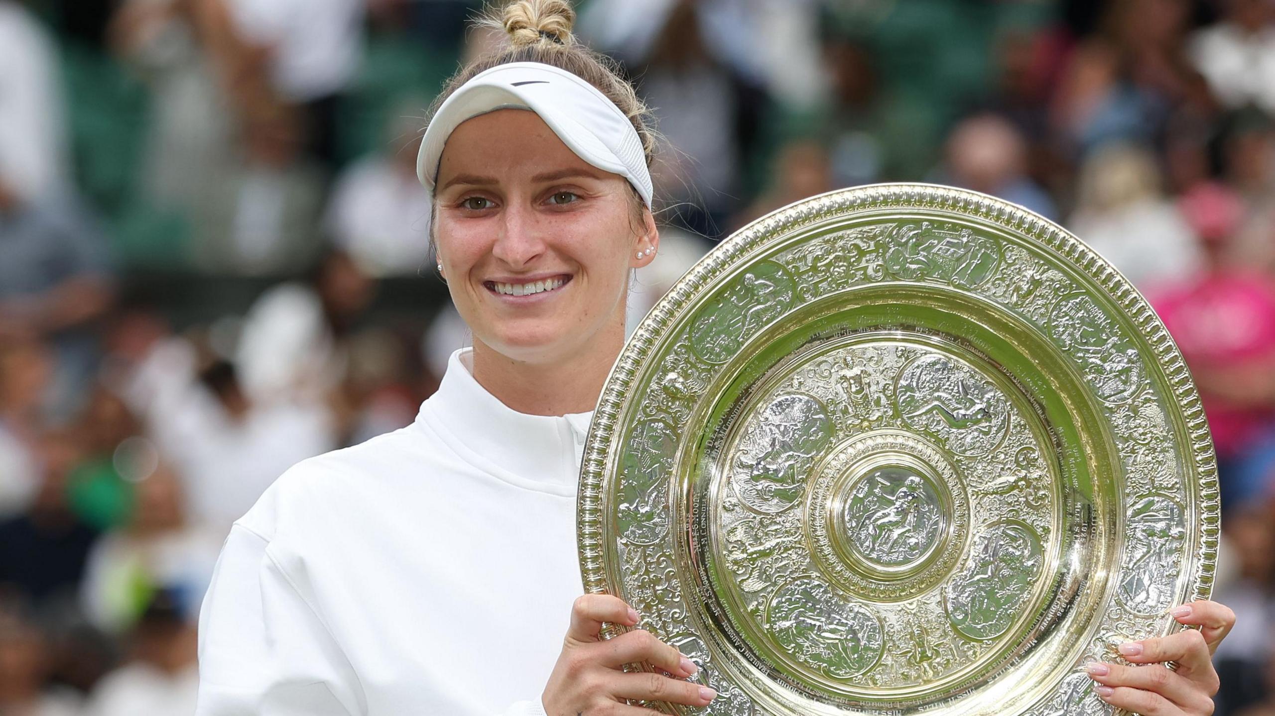 Marketa Vondrousova holding the Wimbledon trophy after winning the women's title in 2023