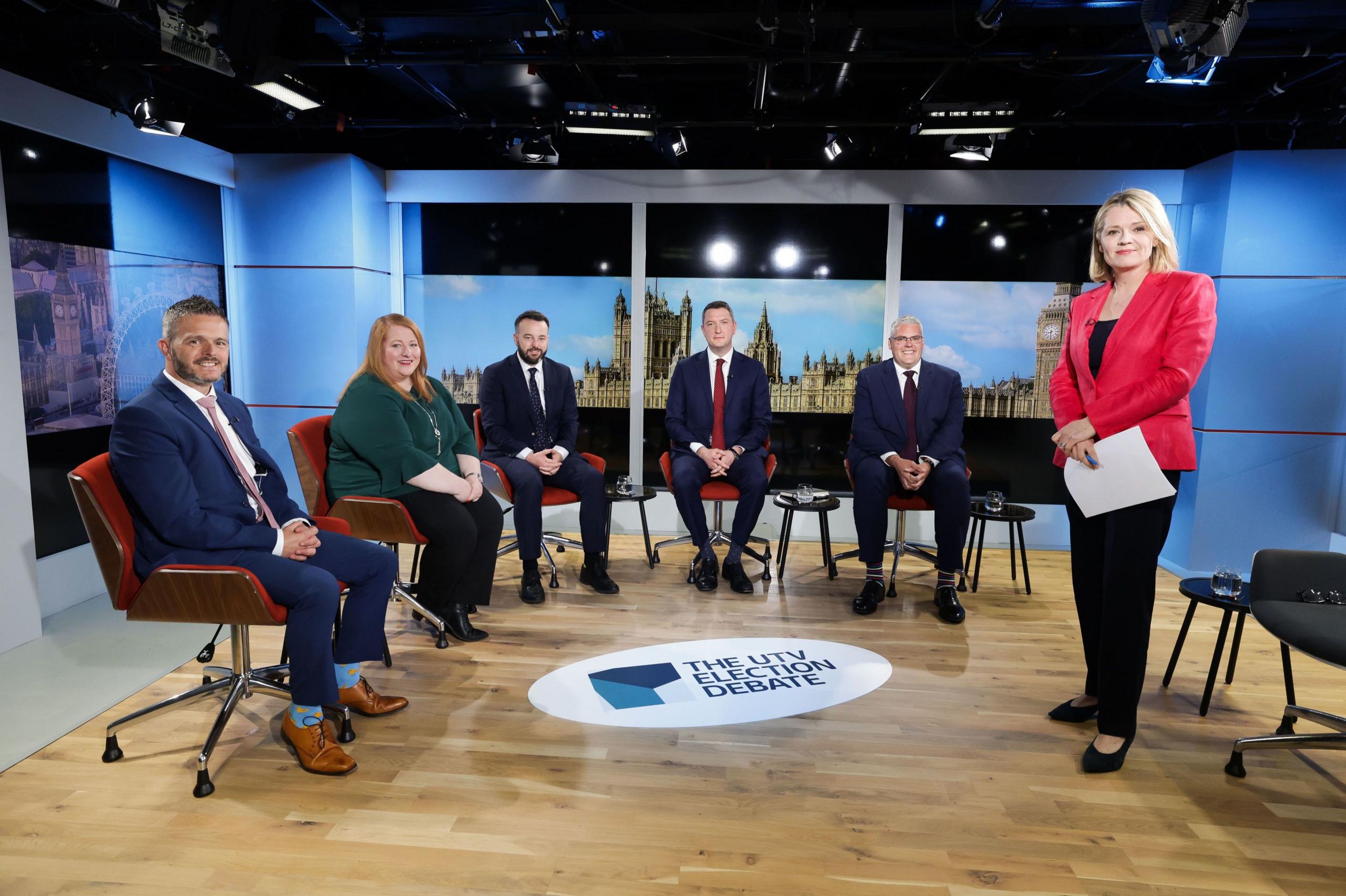 Robbie Butler, Naomi Long, Colum Eastwood, John Finucane and Gavin Robinson sit in the UTV studio while moderator Vicki Hawthorne stands to the right