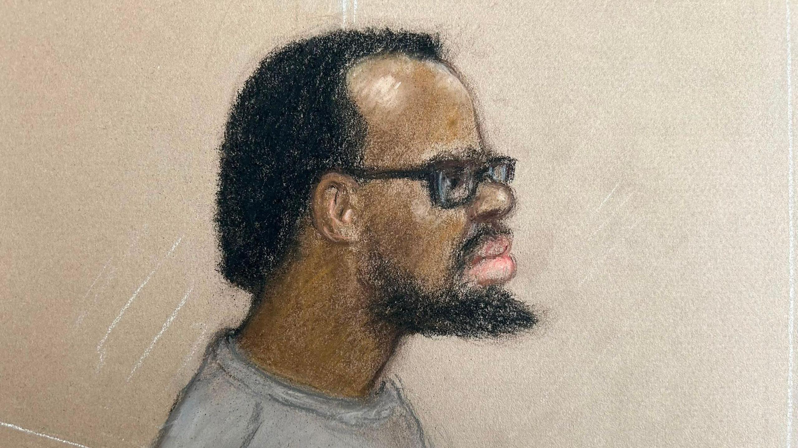 A sketch of a man with a black beard and black afro hair and black rimmed spectacles wearing a grey top.