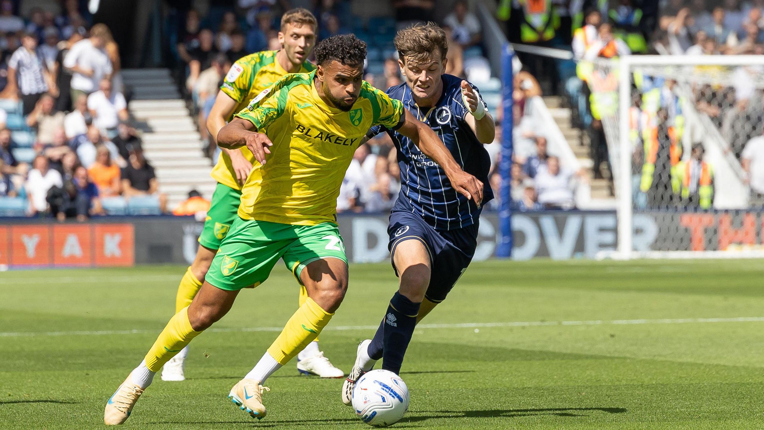 Millwall's Jensen Metcalfe and Norwich City's Anis Ben Slimane battling for the ball during their Championship match on Saturday