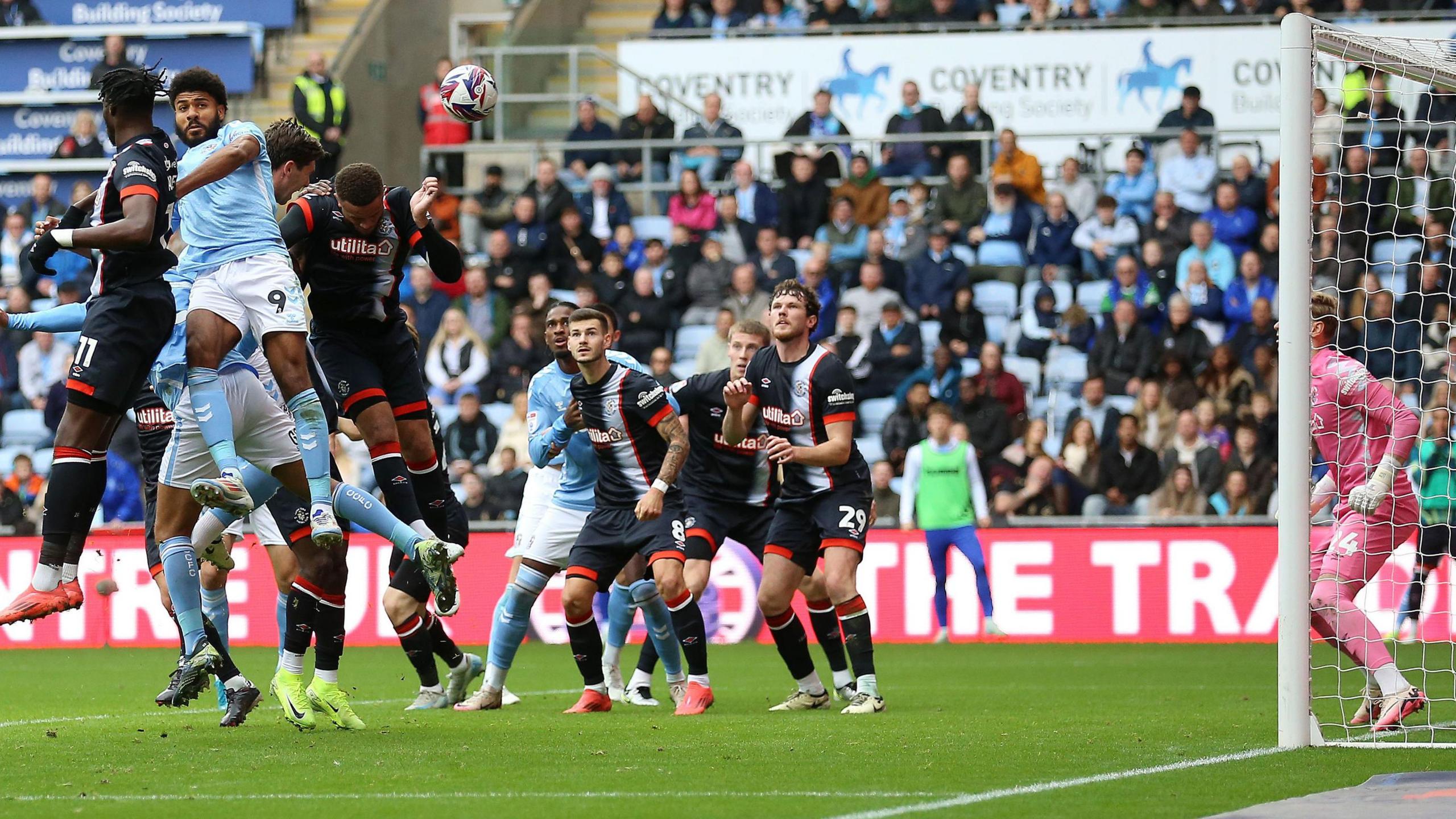 Ellis Simms challenges for a first-half corner in Saturday's 3-2 comeback win over Luton Town at the CBS Arena