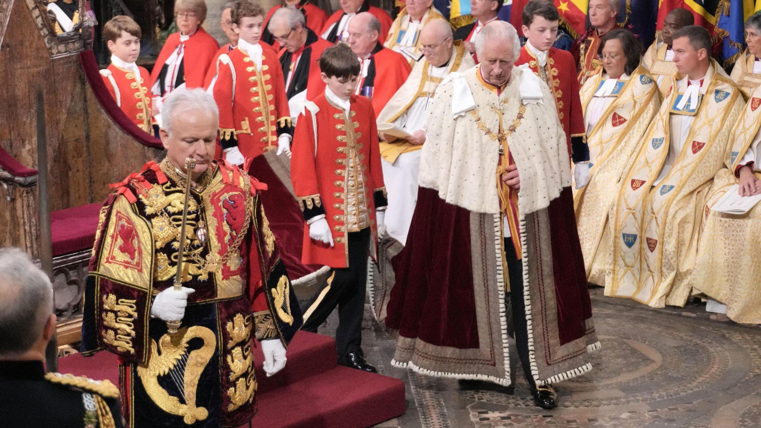 Prince Charles in the abbey with Prince George among his pages