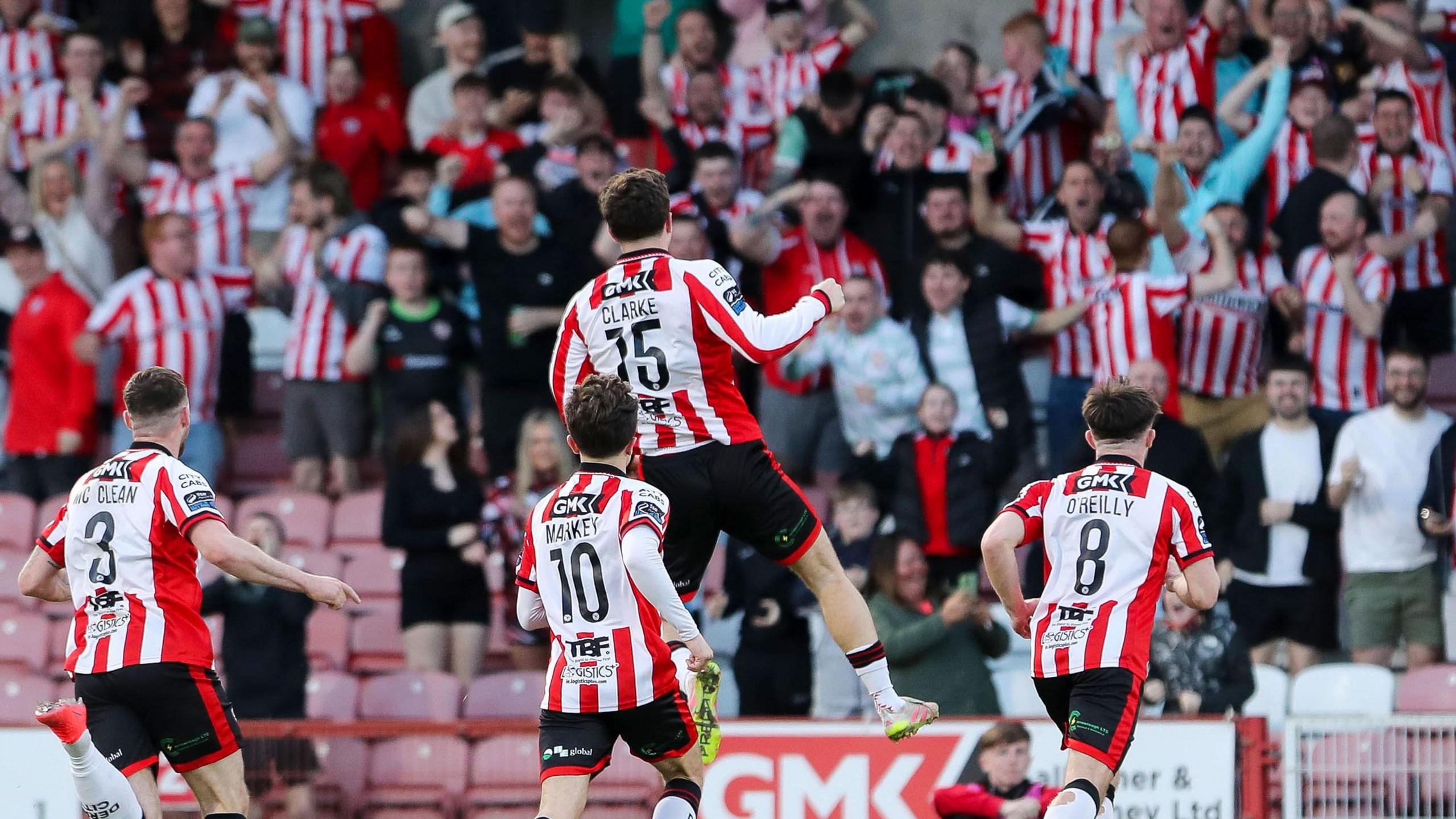 James Clarke celebrates opening the scoring for Derry City against Shamrock Rovers at Celtic Park, celebrating with Patrick McClean, Adam O'Reilly and Darragh Markey