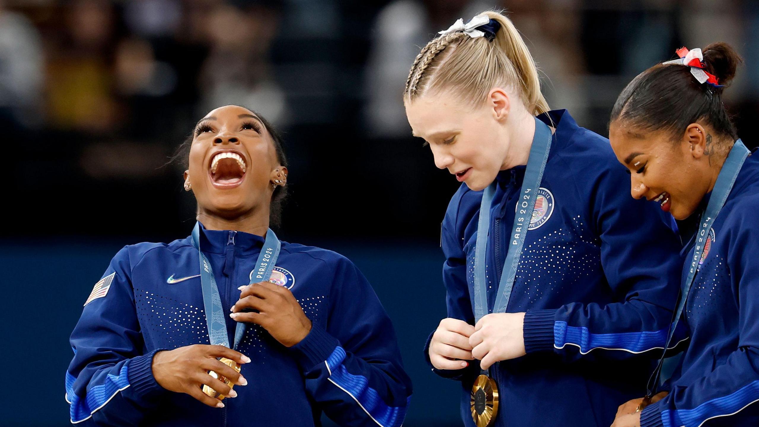 Simone Biles and teammates with gold medals