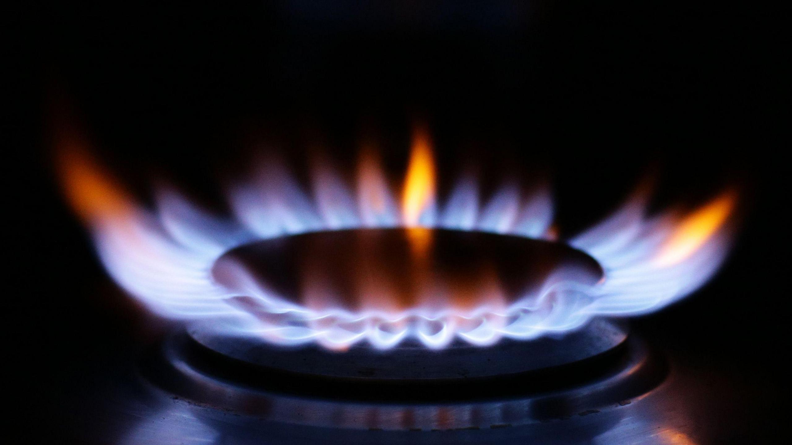 A blue flame on a hob.