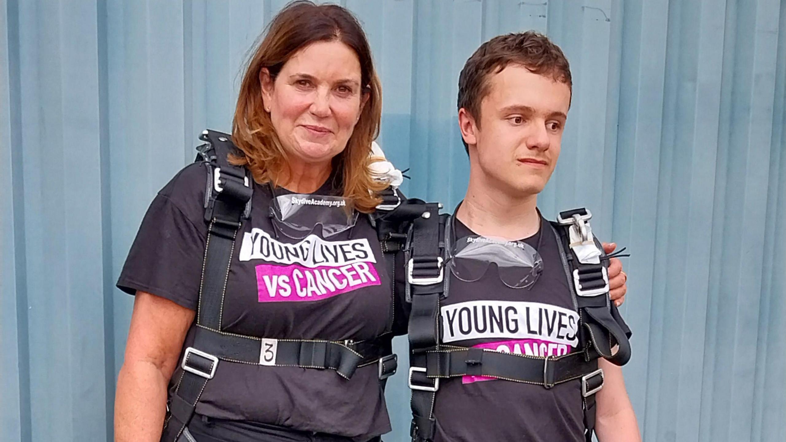  Sam Hughes (left) next to Jack Thompson in harness equipment ahead of the skydive