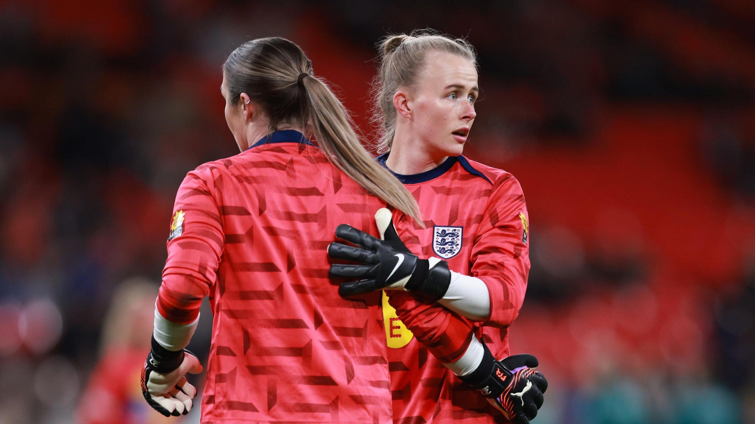 Hannah Hampton and Mary Earps warming up for England
