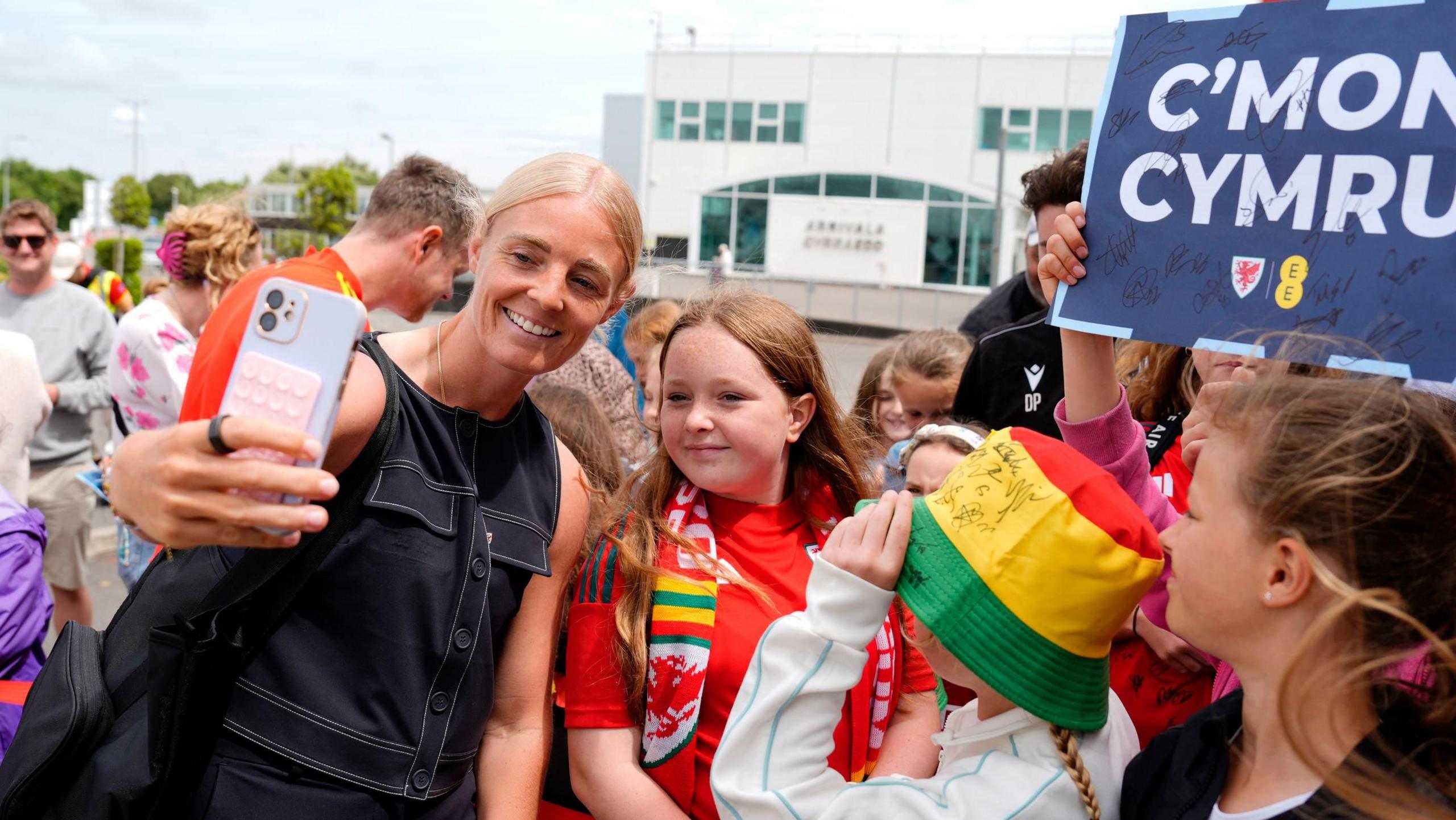 Wales midfielder Sophie Ingle poses for photographs with fans