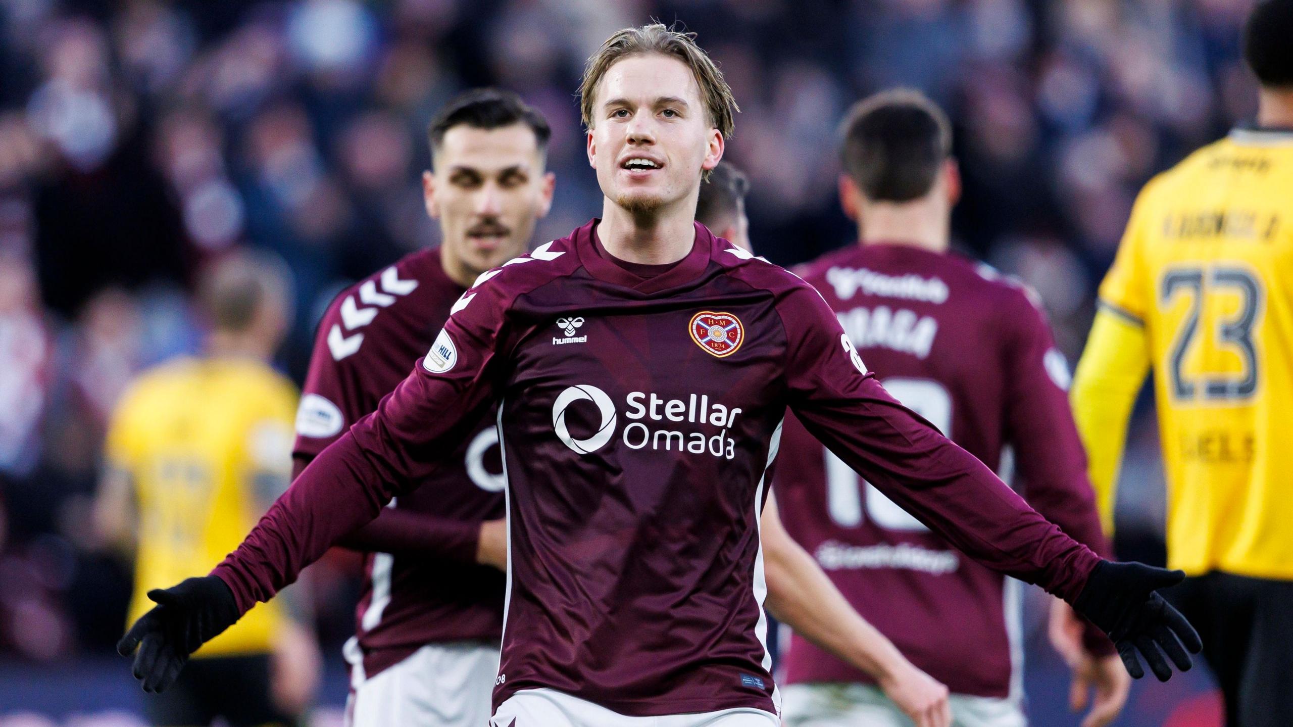 Jordi Altena celebrates Craig Halkett's goal for Hearts against Livingston