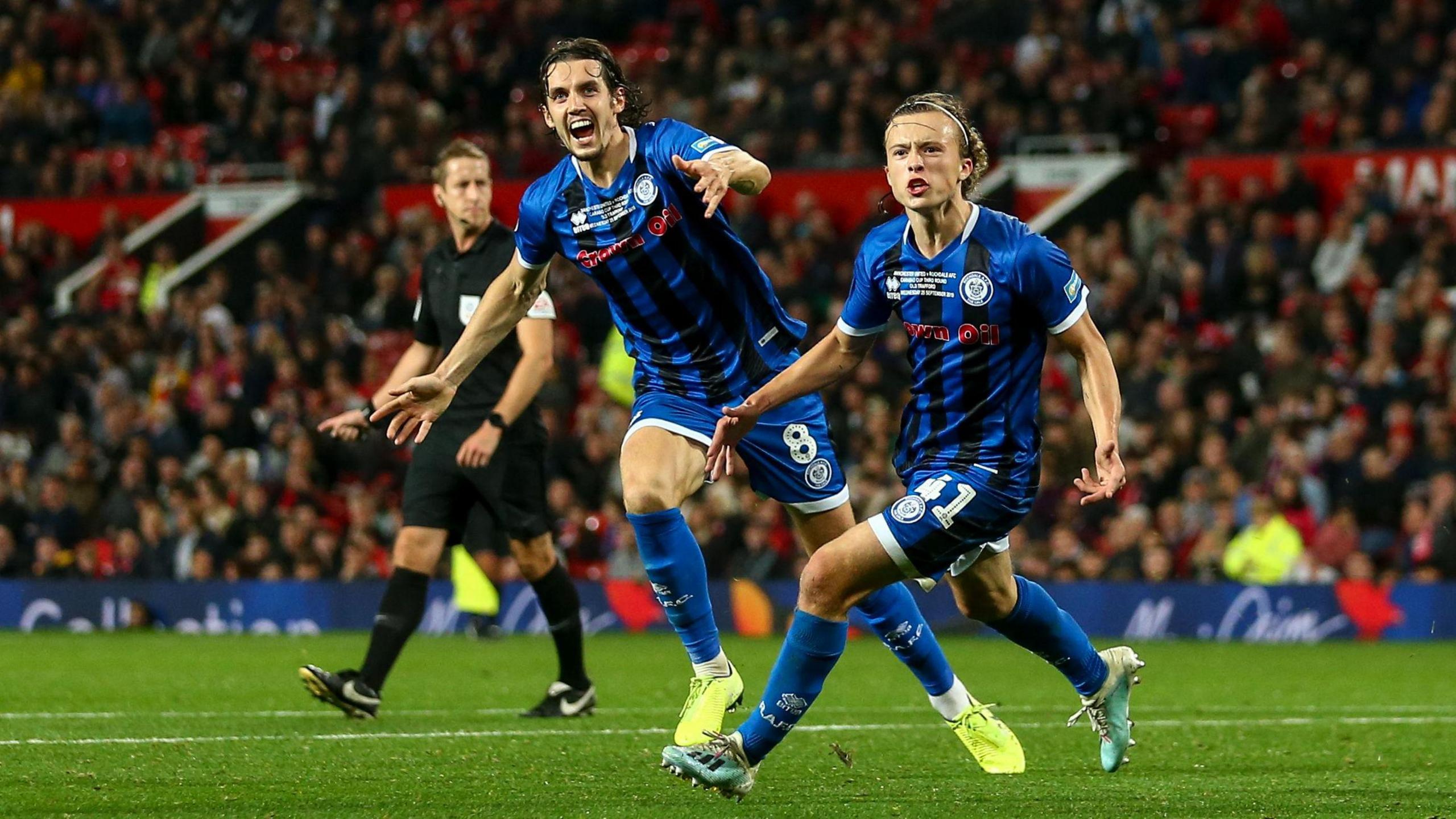 Luke Matheson celebrates scoring at Old Trafford