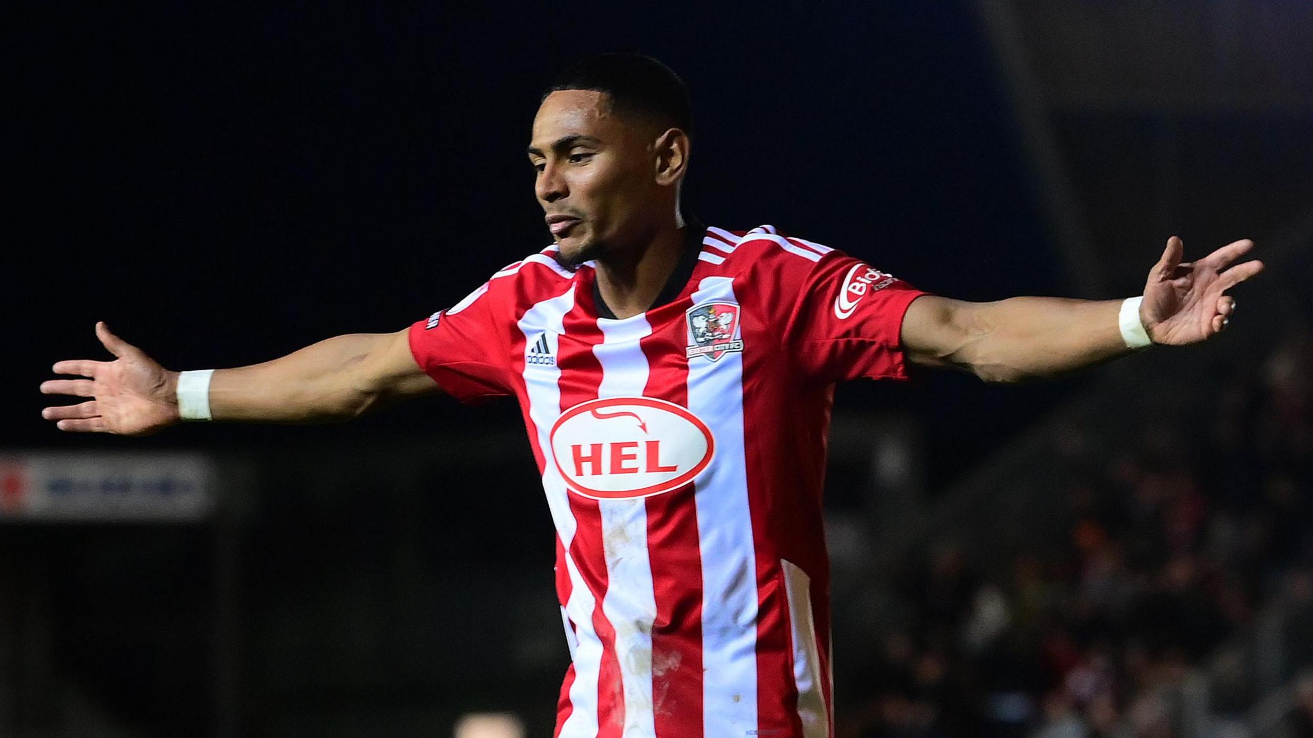 Demetri Mitchell celebrates his equaliser for Exeter against Crawley