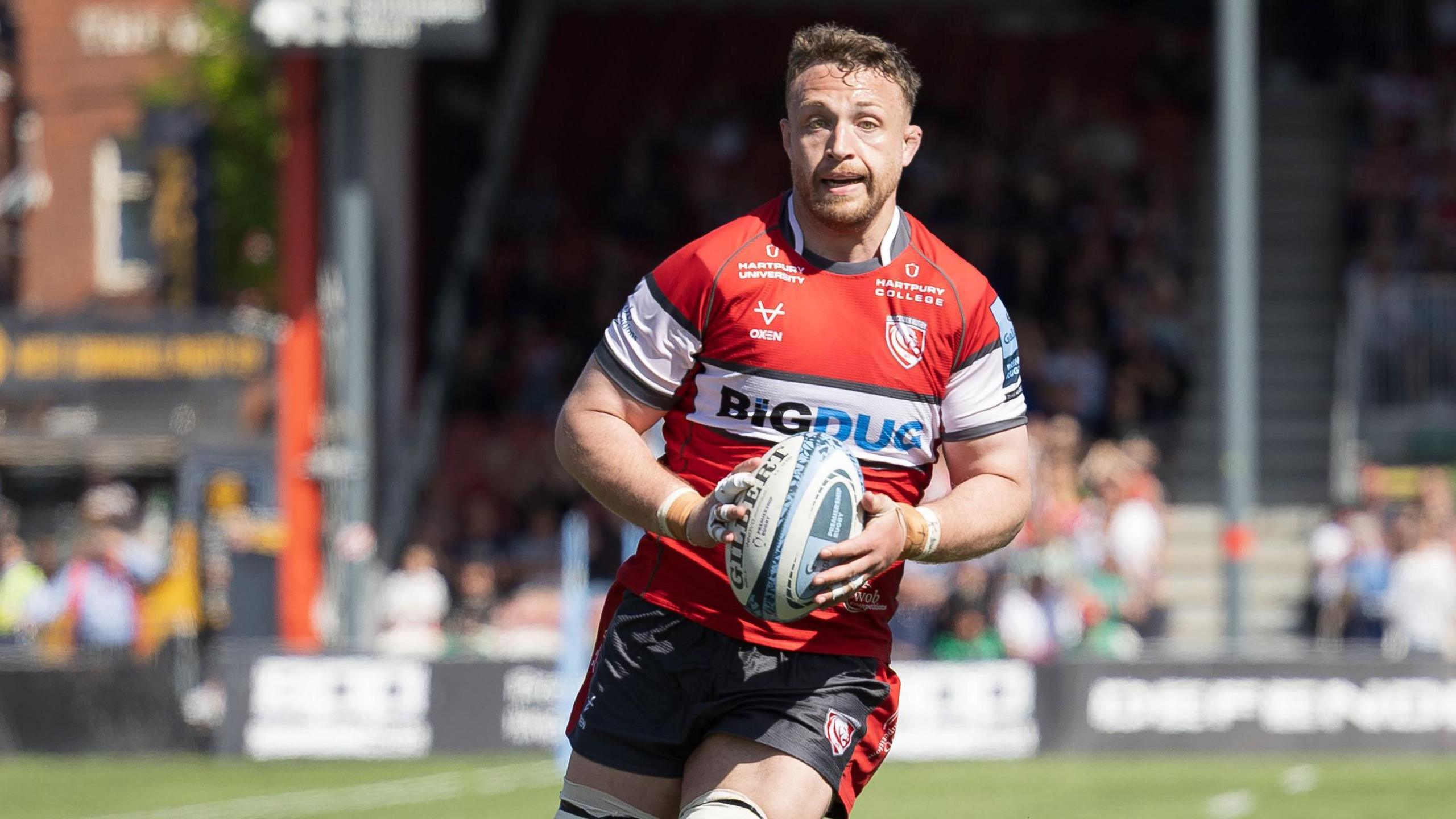 Ruan Ackermann runs with the ball during a match this season