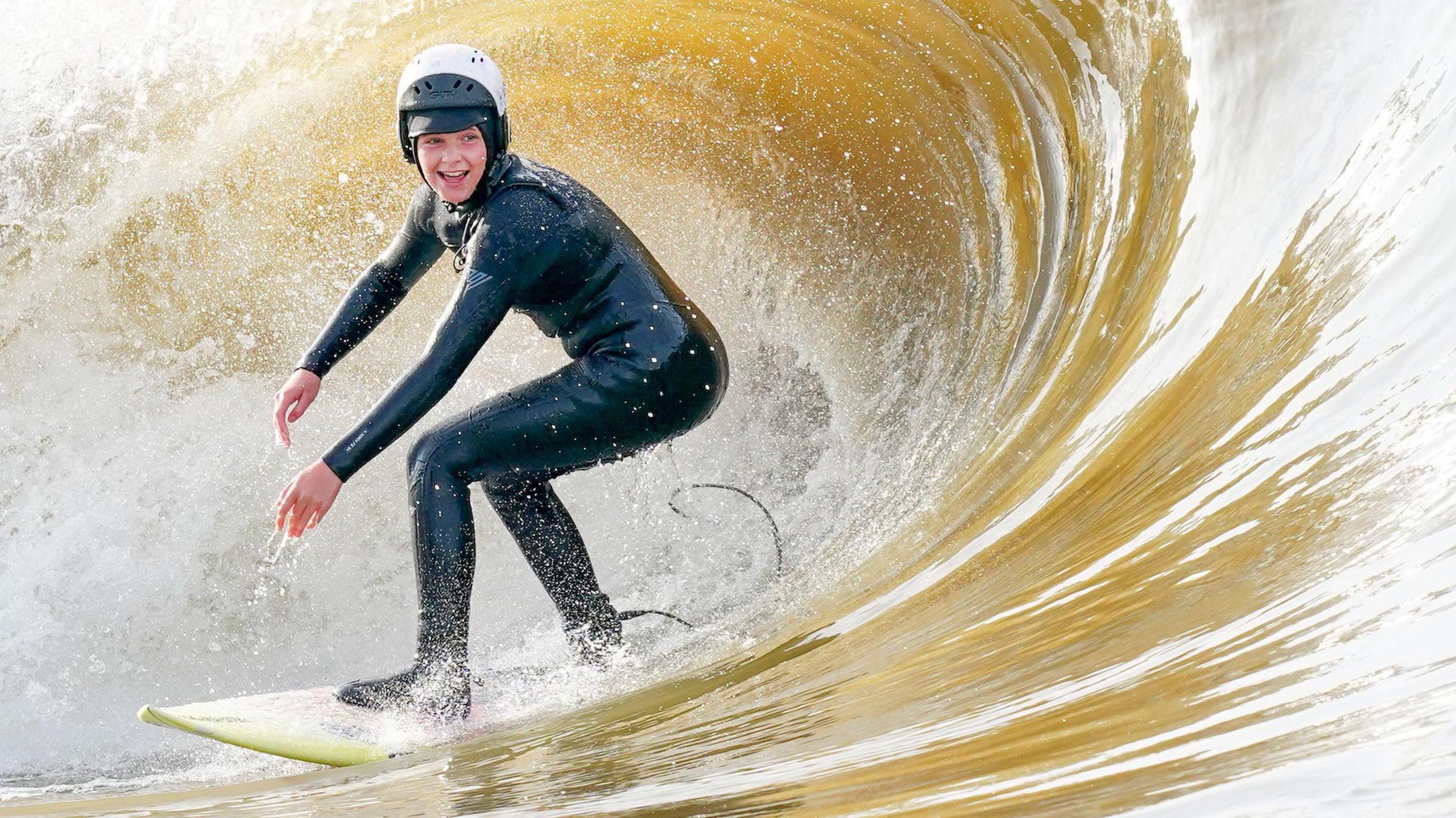 Callie aged 14 surfing a wave