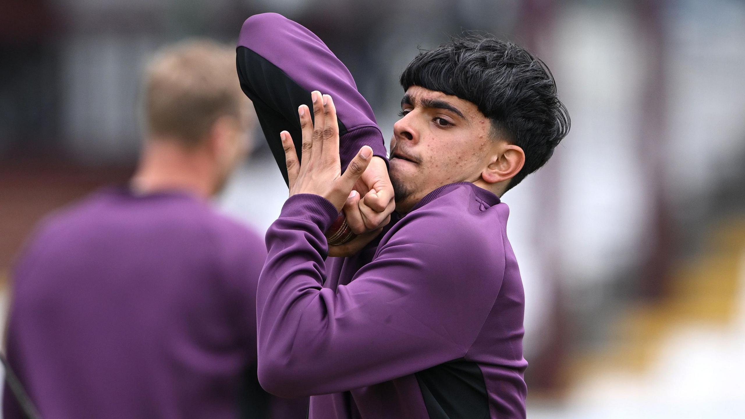 Farhan Ahmed delivers a ball in training