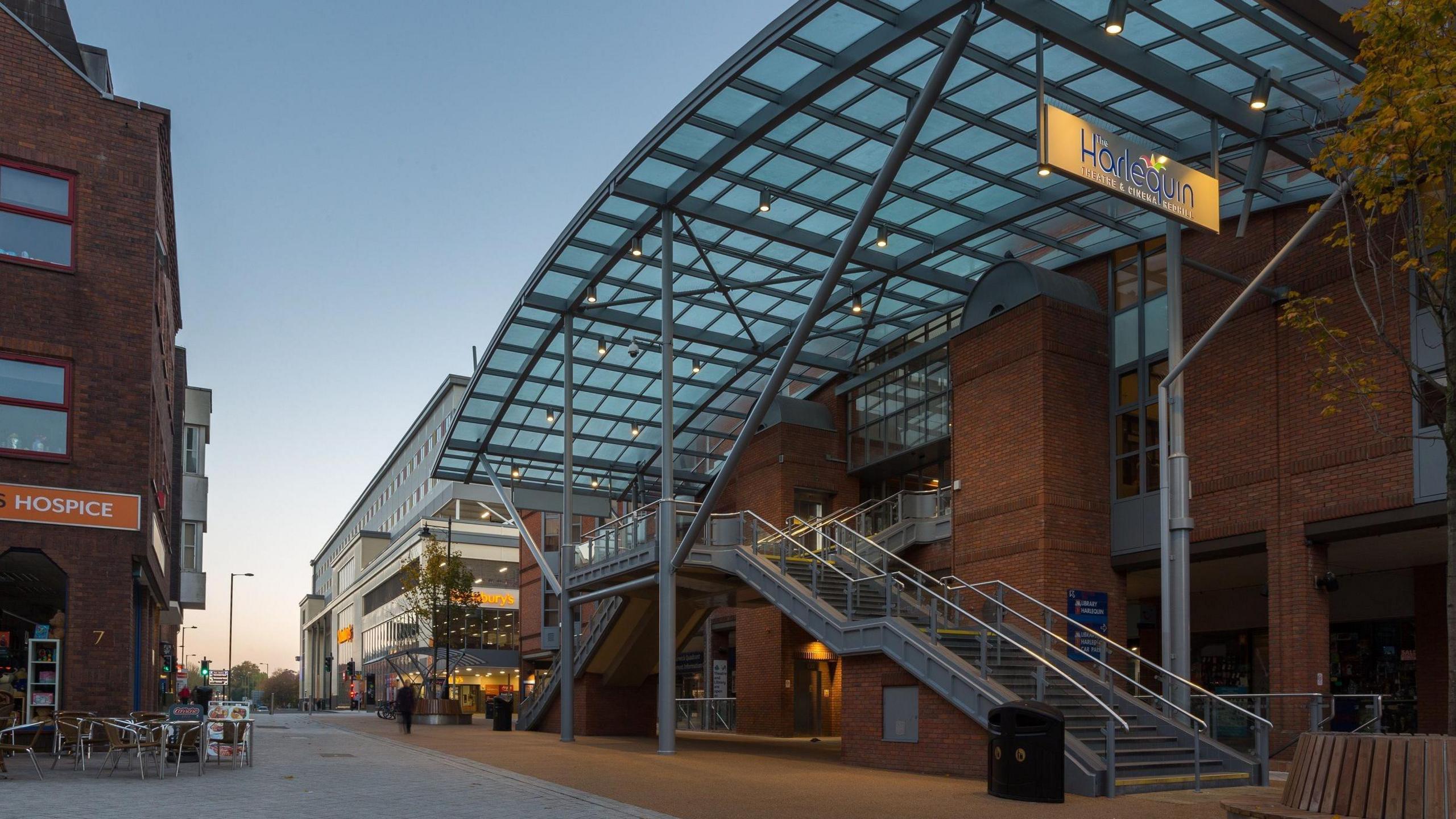 A modern glass and brick building.