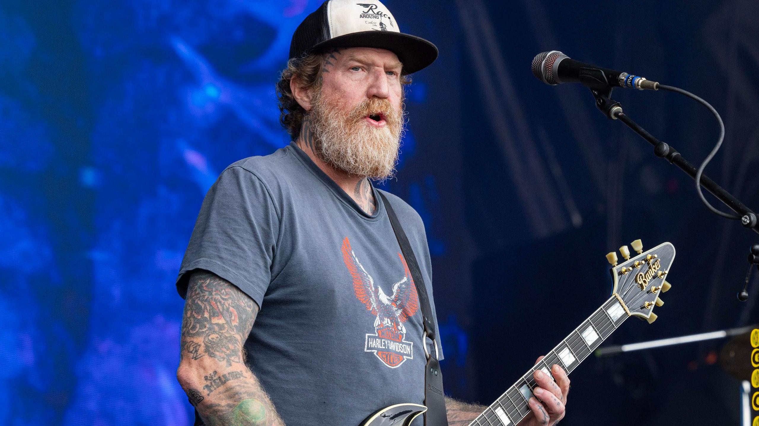 Brent Hinds playing the guitar on stage