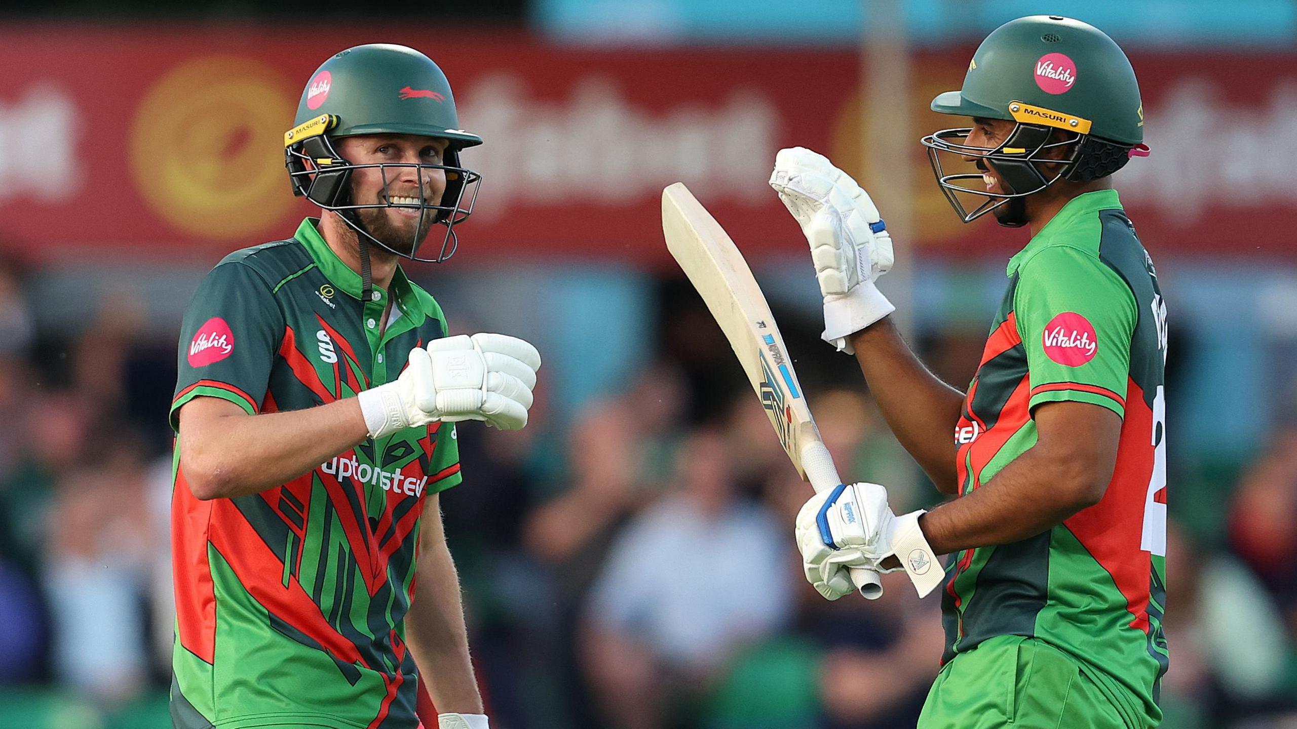 Leicestershire batter Sol Budinger (left) celebrates his 50 with Rishi Patel