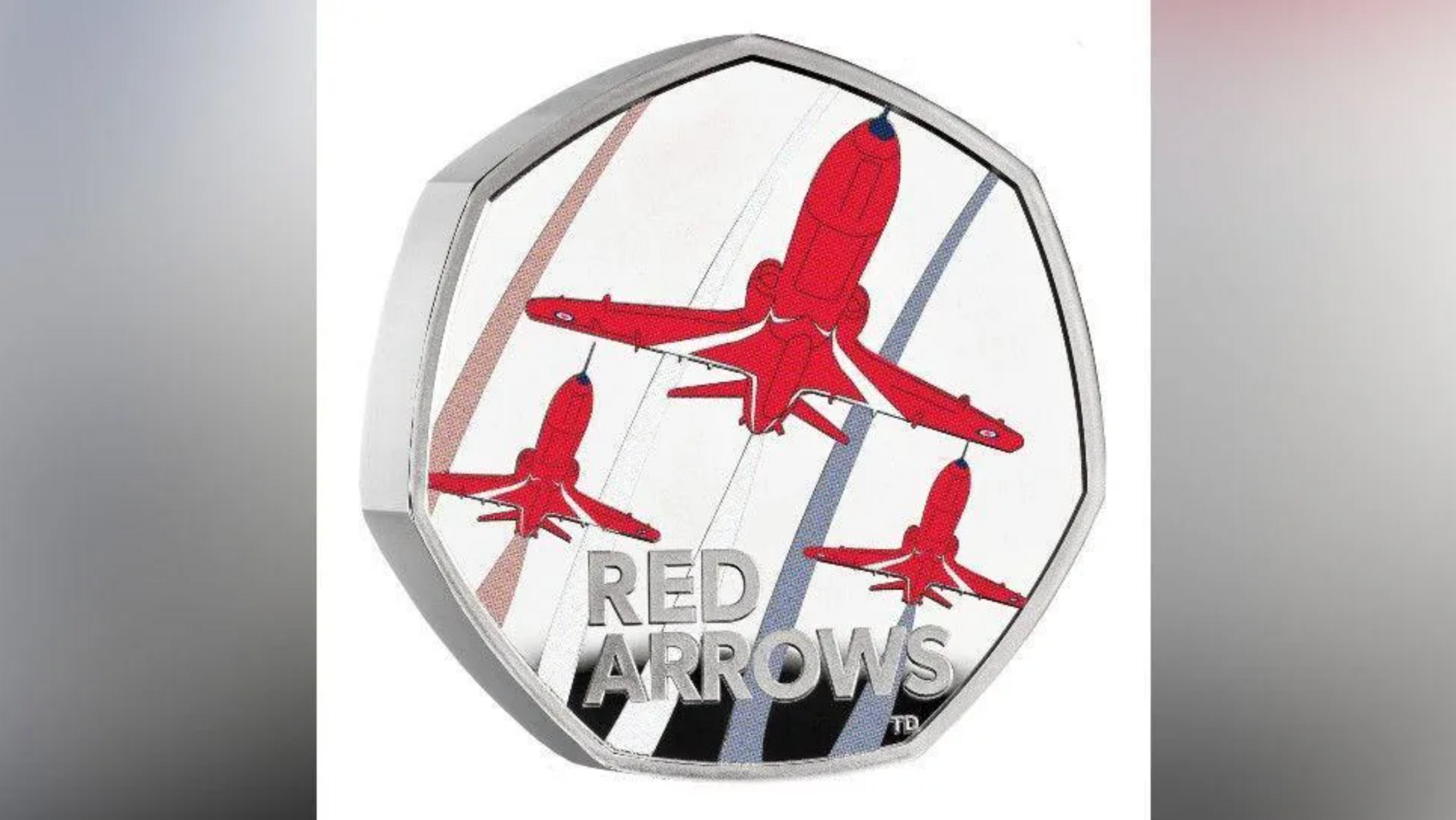 Red arrow design on a 50p coin.