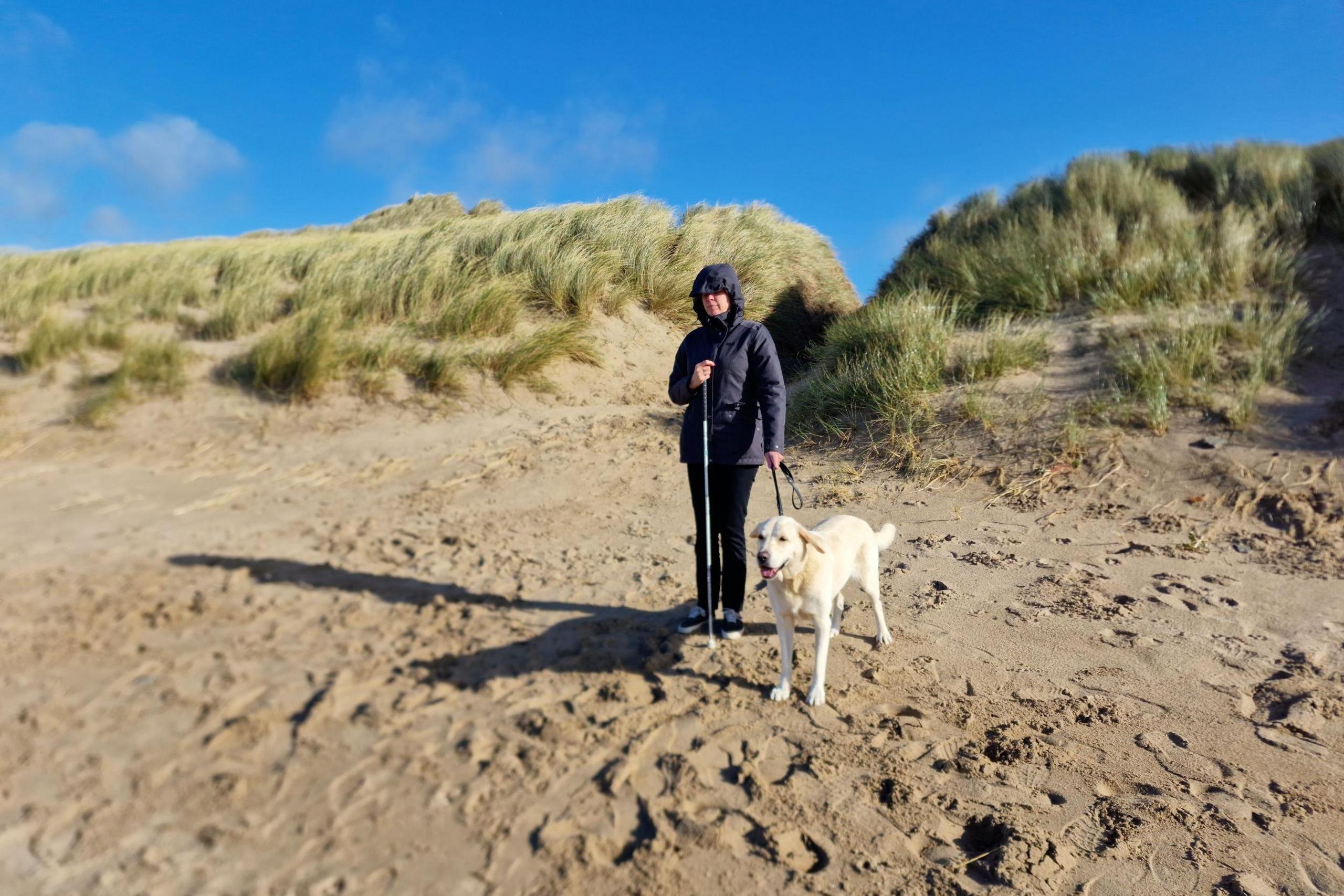 Louann Kent at the beach with Ugo