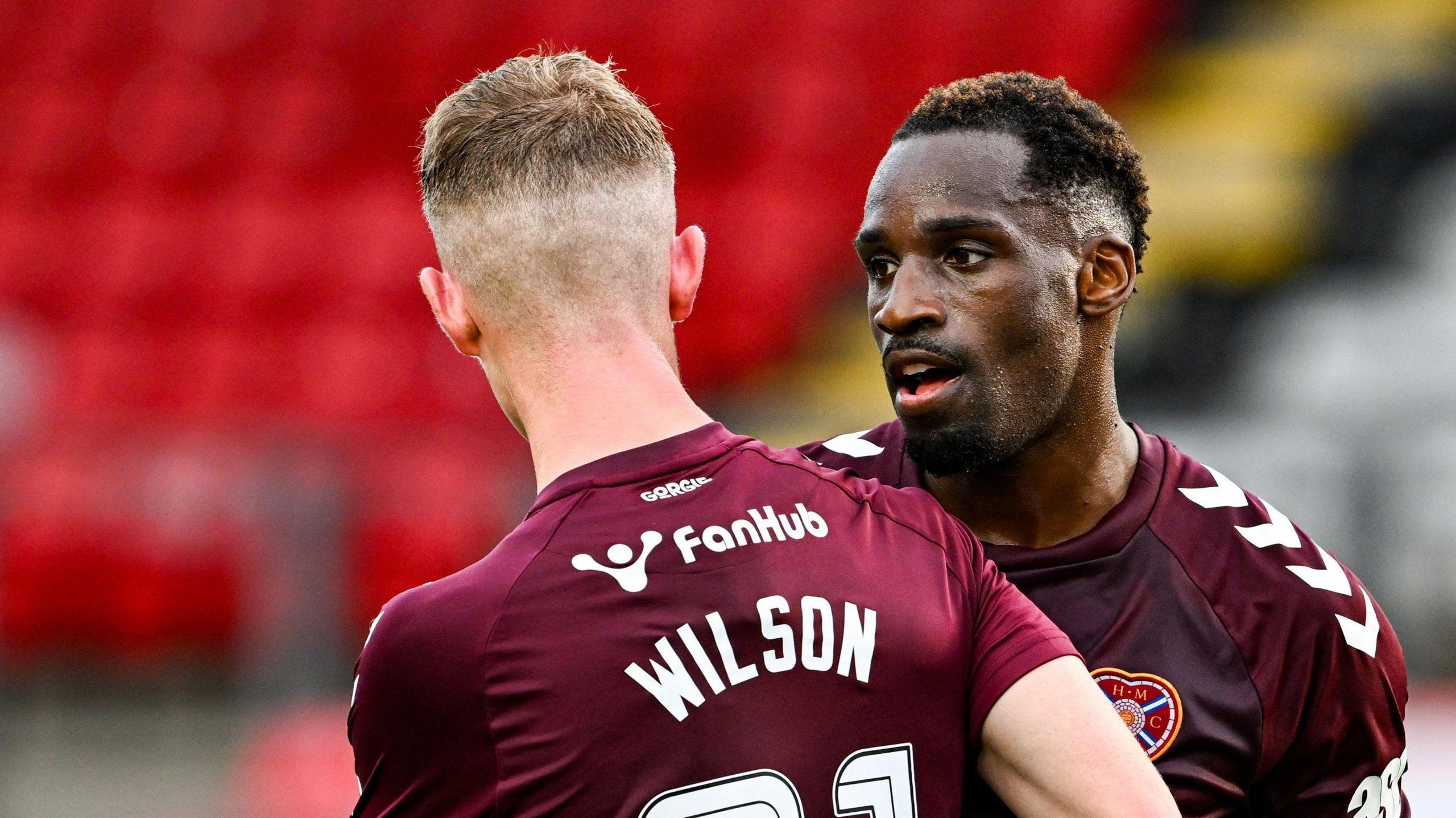 Hearts' Elton Kabangu (R) celebrates scoring to make it 2-0 with teammate James Wilson during a Premier Sports Cup group stage match between Hamilton Academical and Heart of Midlothian at Broadwood Stadium