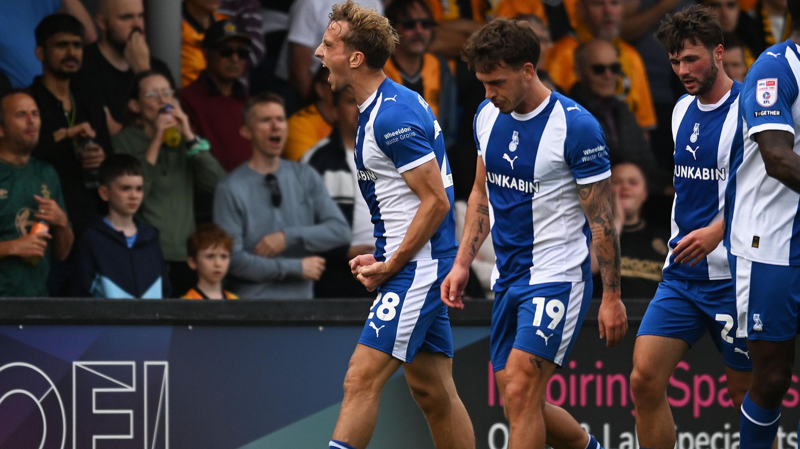 Michael Mellon celebrates after scoring for Oldham Athletic