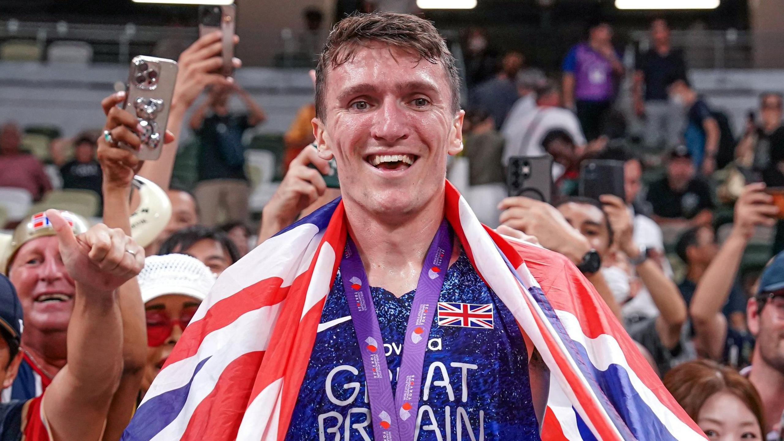 Jake Wightman celebrates with British fans 