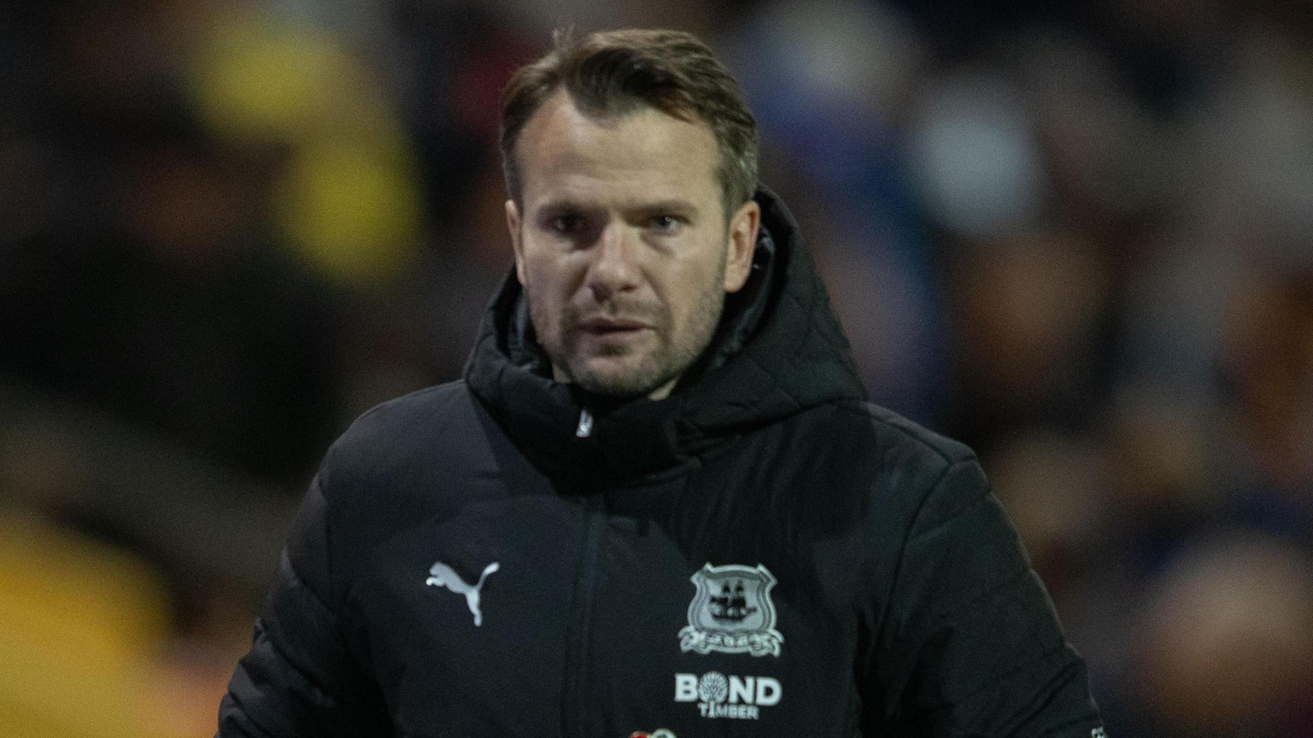 Tom Cleverley watches on during Plymouth's defeat to Mansfield 