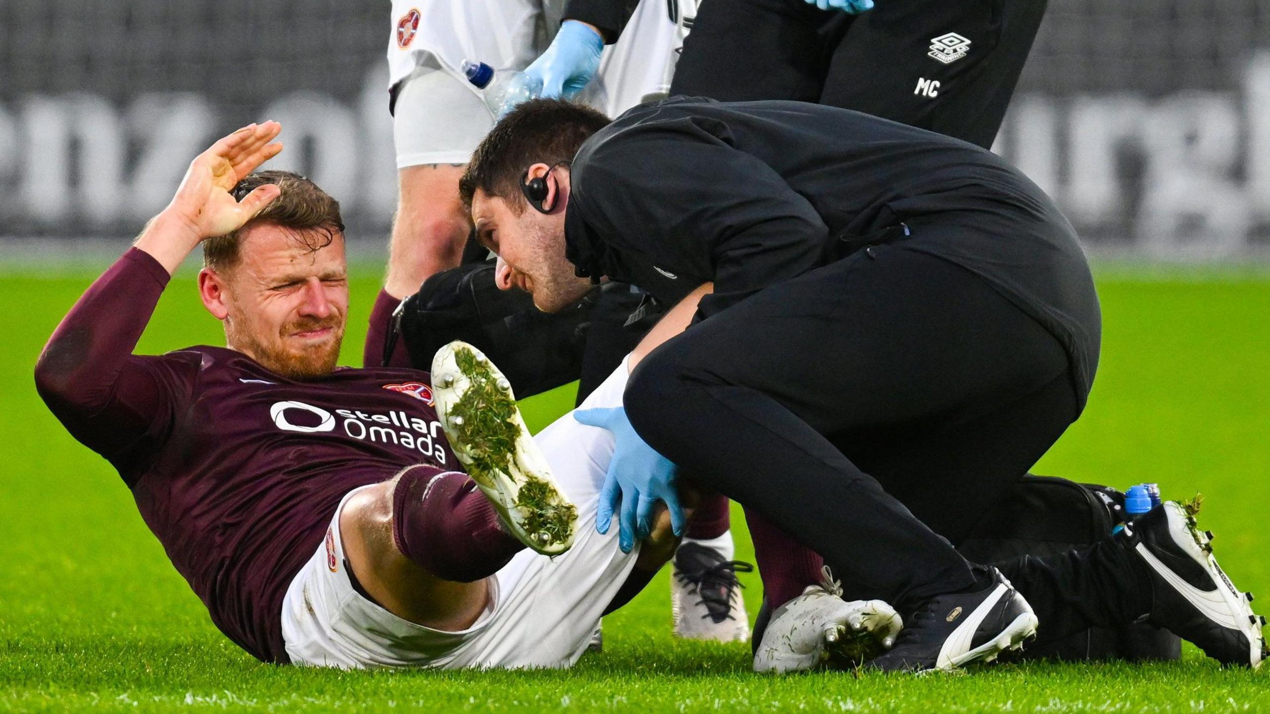 Hearts' Stephen Kingsley receives treatment